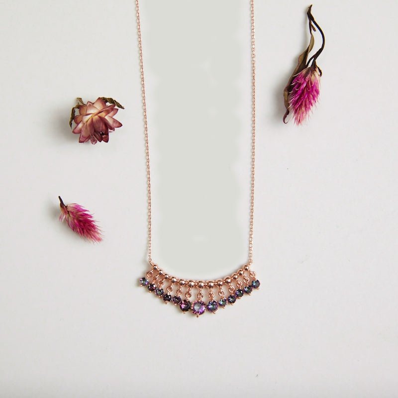 Elegant purple crystal pendant silver necklace with dangles, showcasing handmade craftsmanship and 18k rose gold plating.