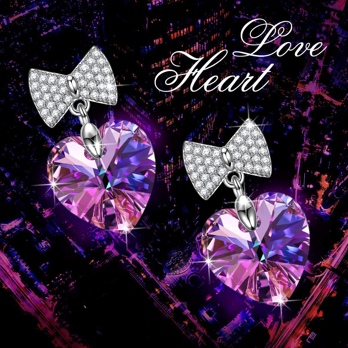 Elegant purple heart shaped bow-tie pave drop earrings made of 14K white gold plated brass with a stunning crystal centerpiece.