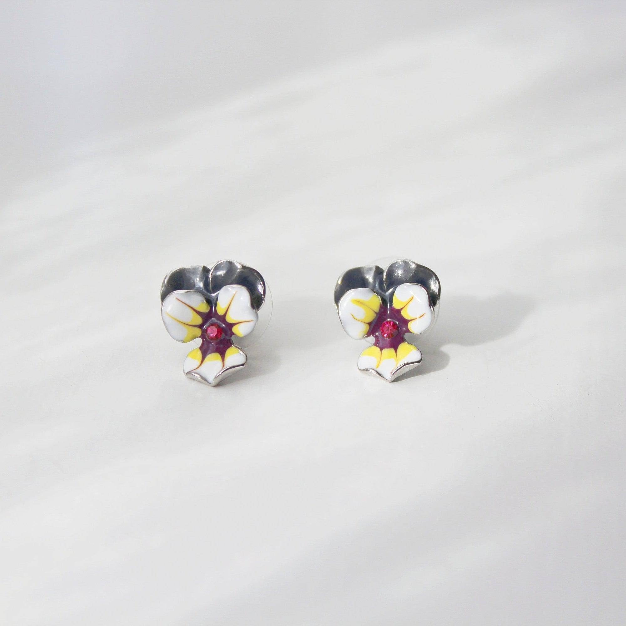 A pair of elegant purple and yellow pansy flower stud earrings made from sterling silver and bronze with enamel coating.