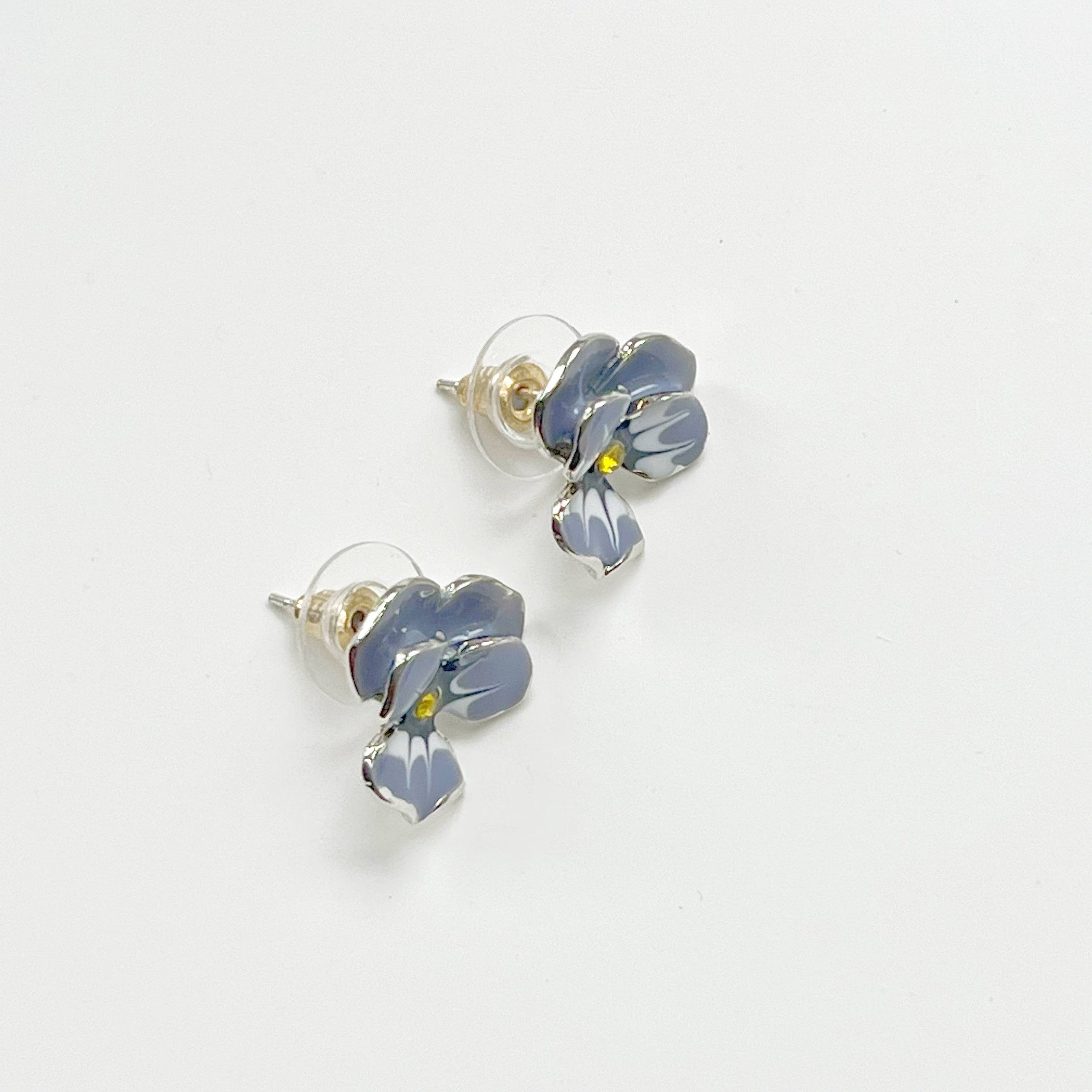 Purple Pansy Flower Earrings with silver base and enamel finish, showcasing vibrant colors and elegant design.