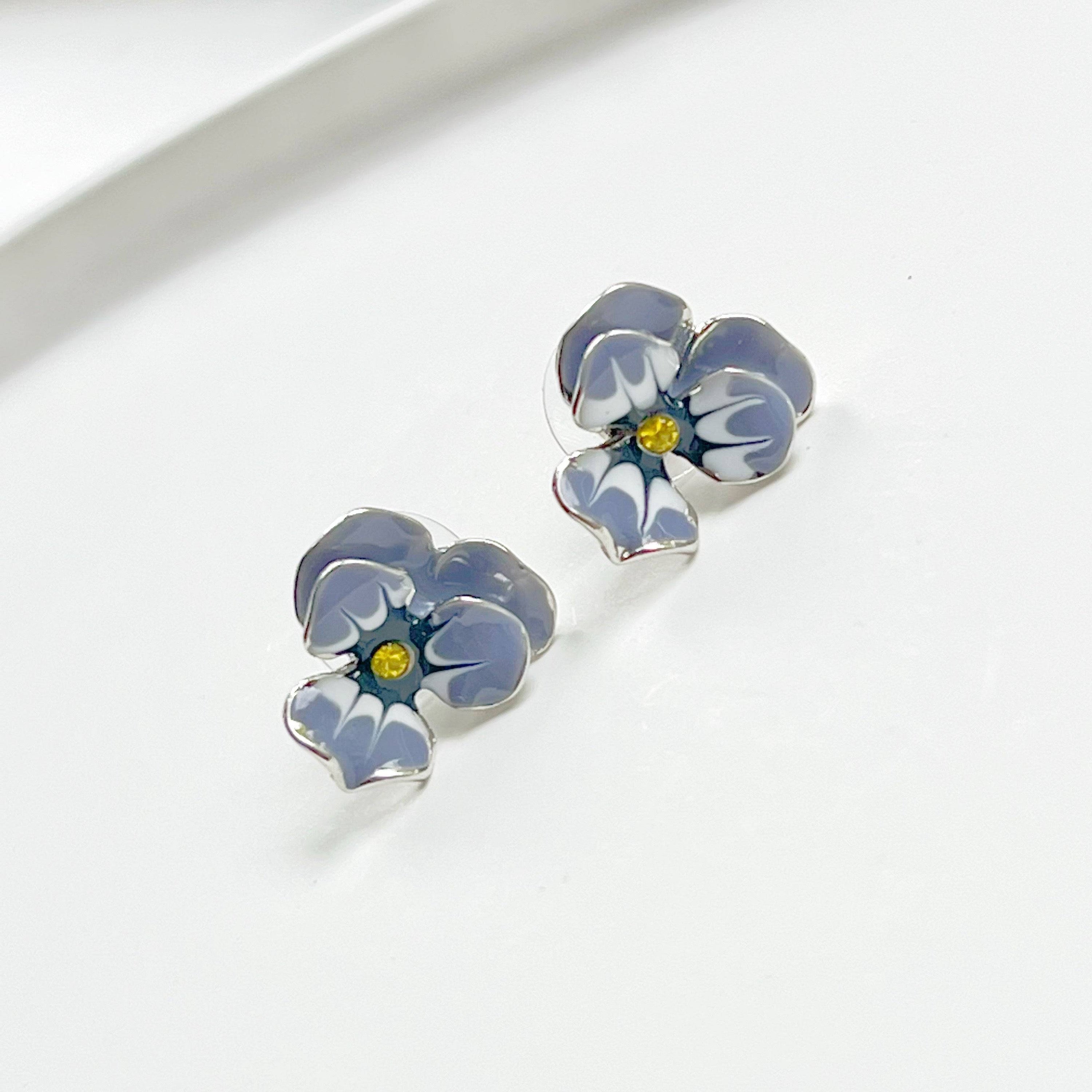 Purple Pansy Flower Earrings with silver base and enamel finish, showcasing vibrant colors and elegant design.