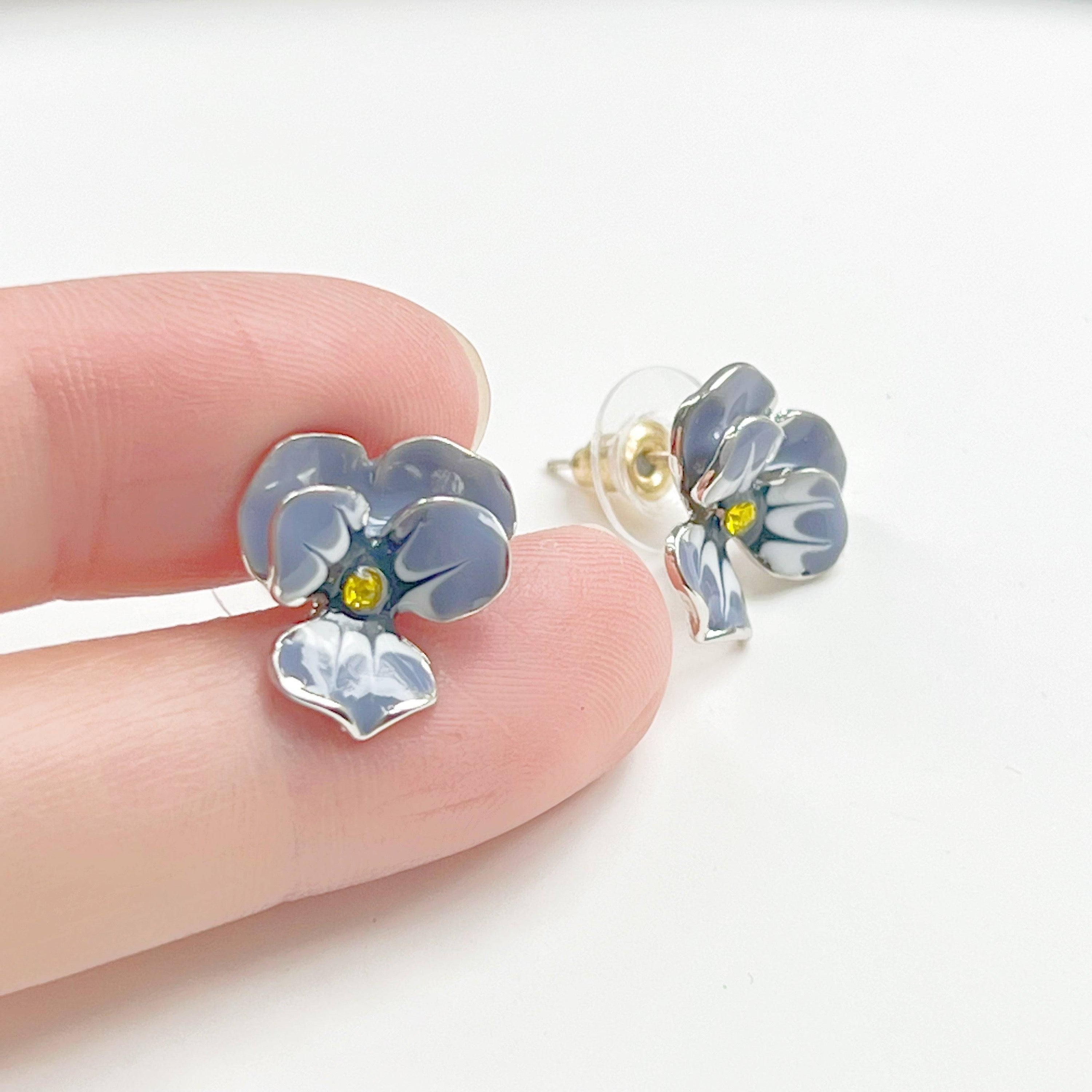 Purple Pansy Flower Earrings with silver base and enamel finish, showcasing vibrant colors and elegant design.