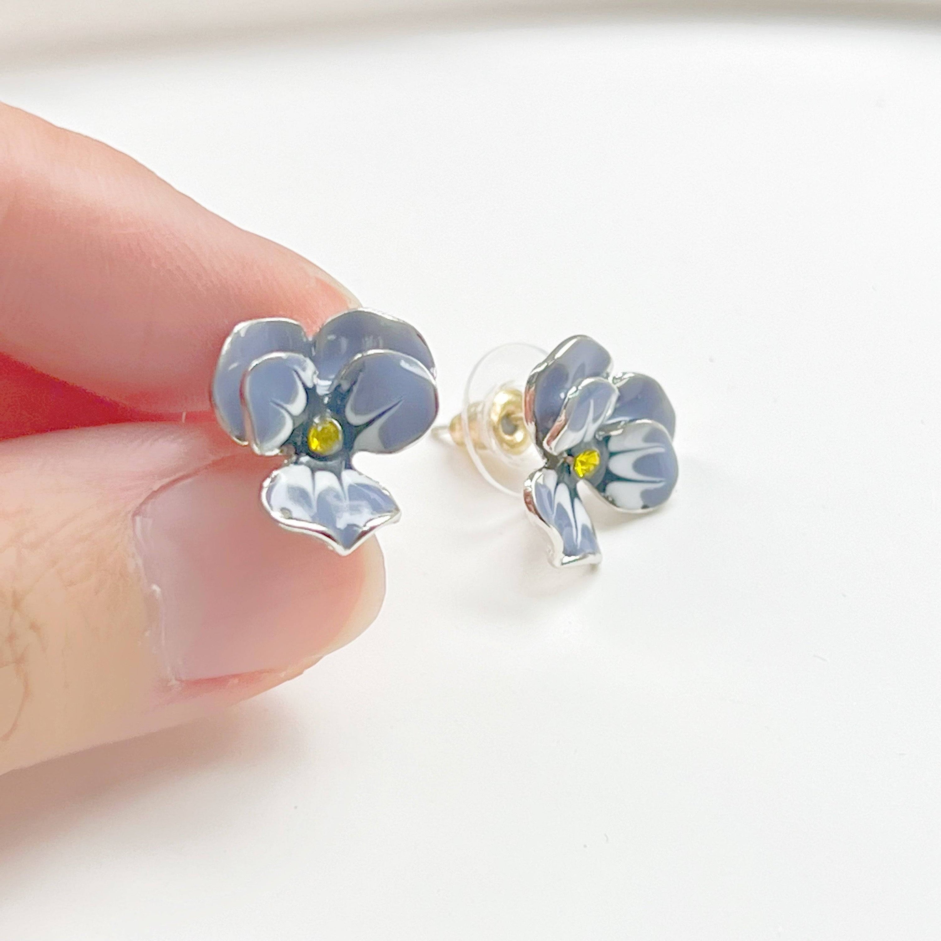 Purple Pansy Flower Earrings with silver base and enamel finish, showcasing vibrant colors and elegant design.