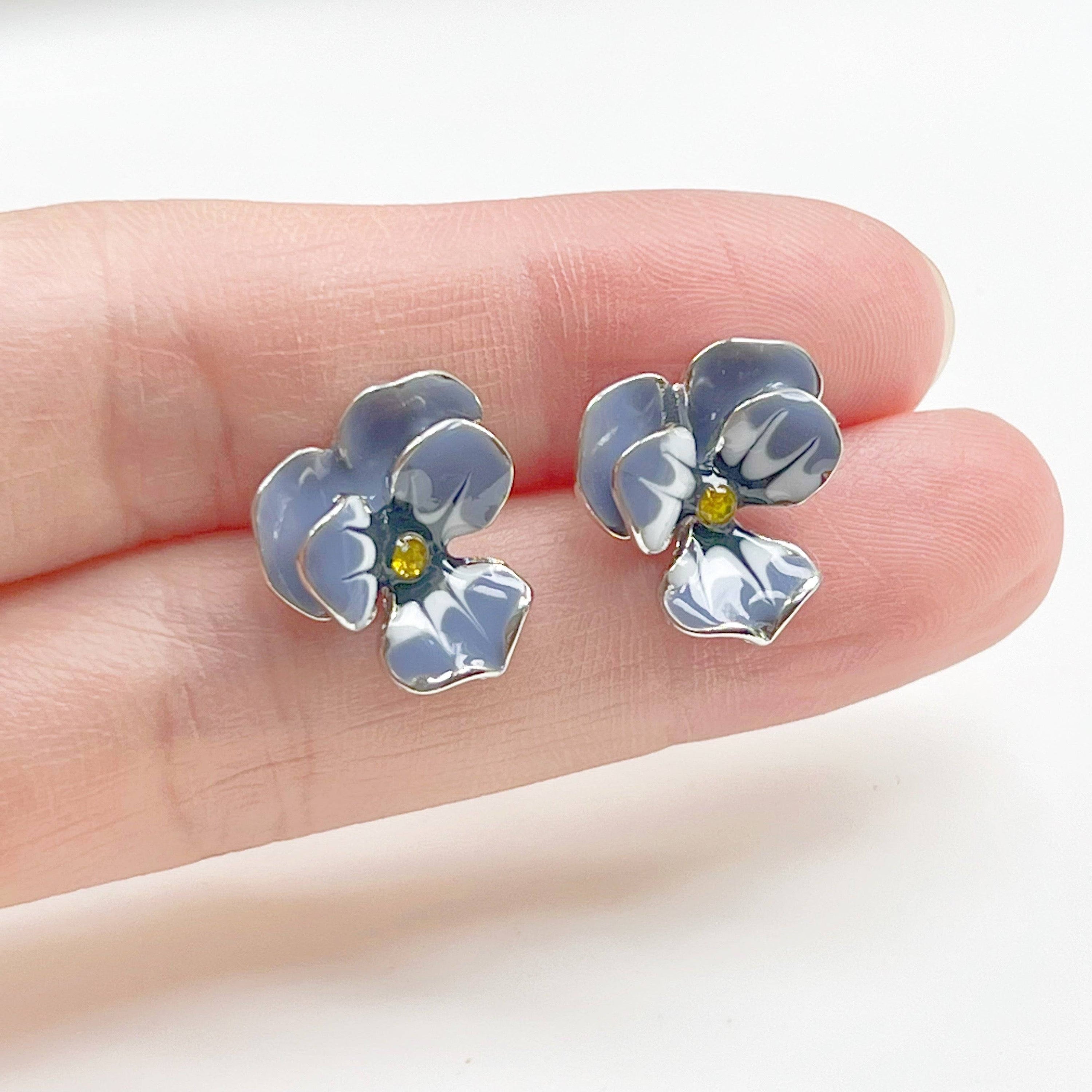 Purple Pansy Flower Earrings with silver base and enamel finish, showcasing vibrant colors and elegant design.