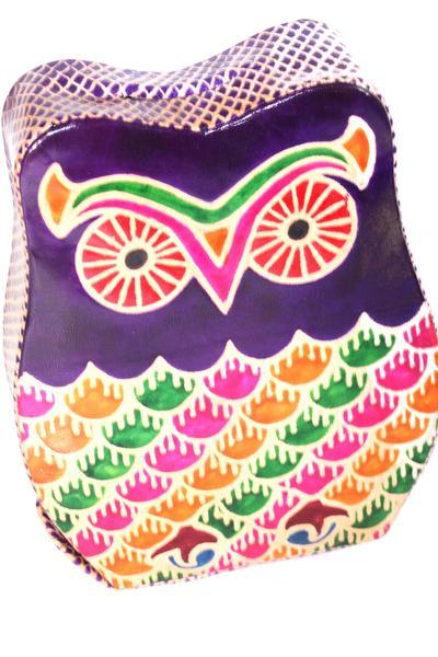 A colorful purple vintage owl leather coin bank, handcrafted with an embossed design, perfect for saving loose change.