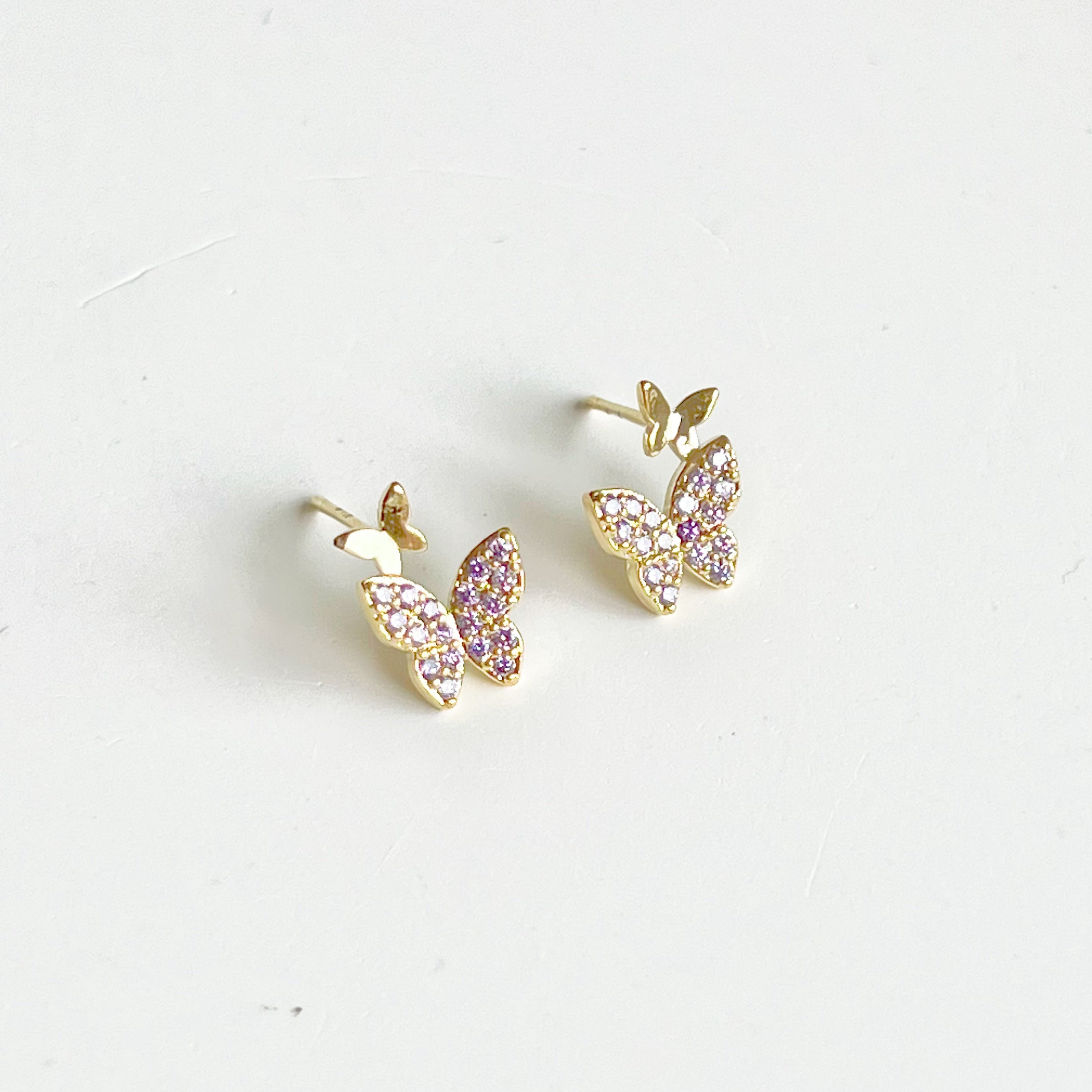 Elegant Purple Zircon Butterflies Earrings made from gold-plated sterling silver and bronze, featuring sparkling purple zircon stones.