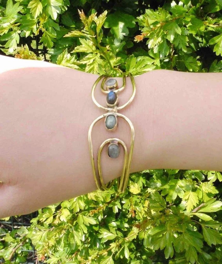 Elegant Quadra Stone Bangle Bracelet made of brass and semi-precious stones, showcasing a lightweight and adjustable design.