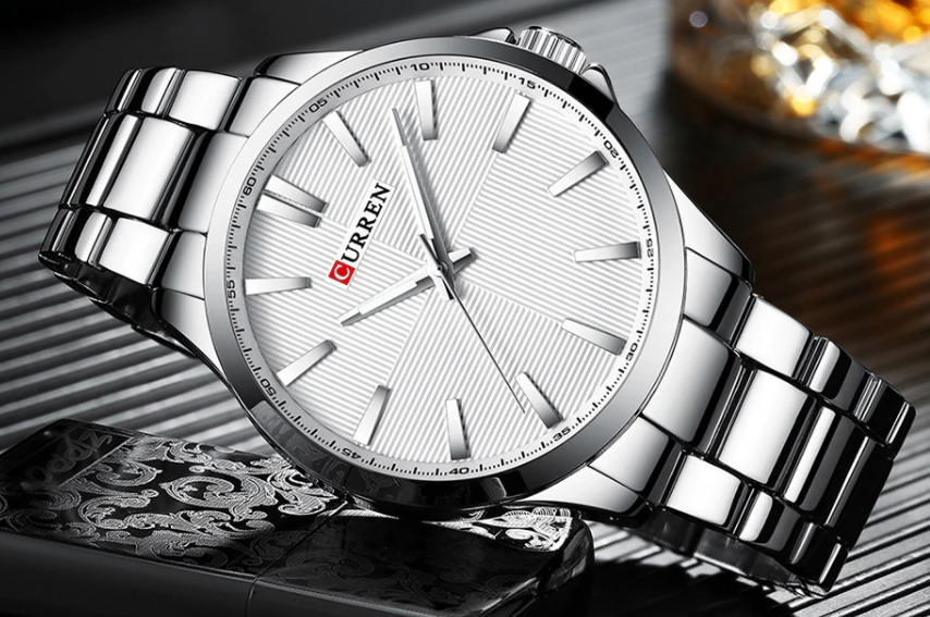 QUAINT Metal Timepiece with stainless steel strap and round dial, showcasing elegance and sophistication.