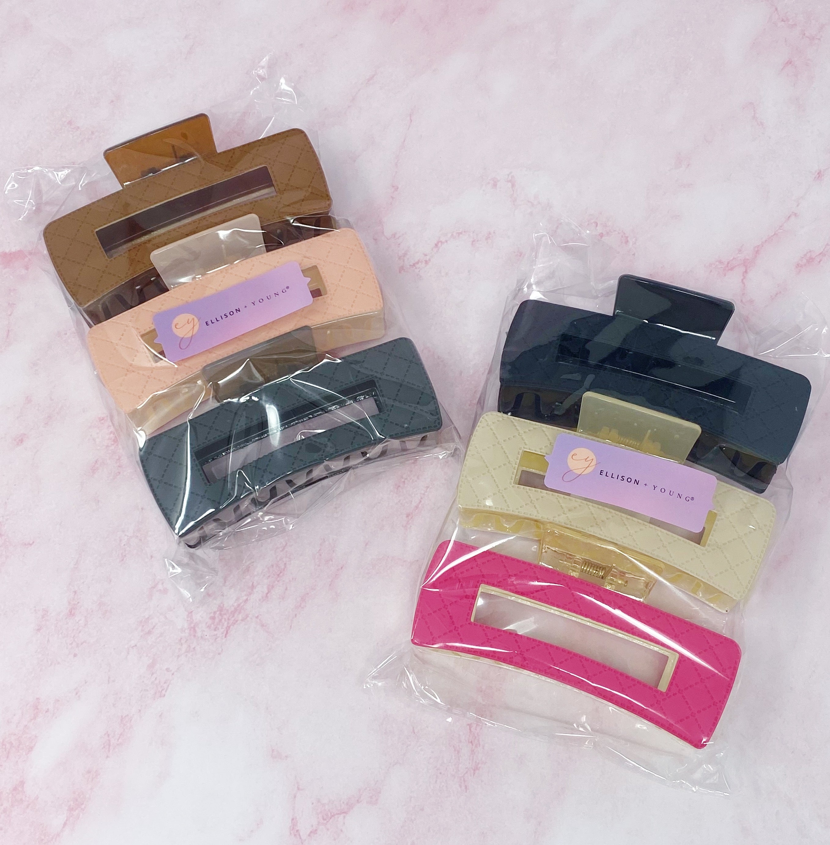 A stylish set of three quilted hair claws in vibrant colors, perfect for securing hair in place with elegance.