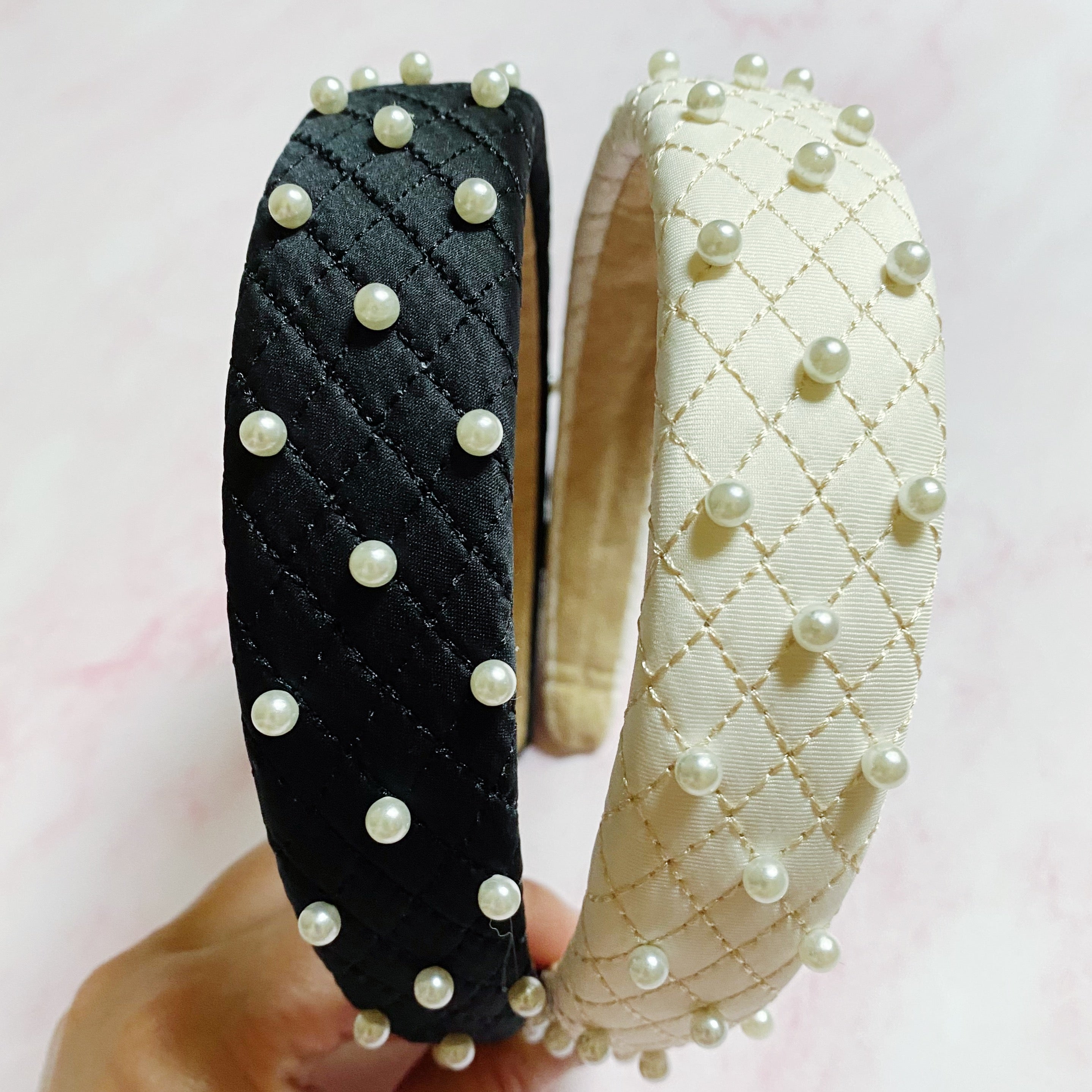 Quilted Elegance Pearl Headband featuring quilted fabric and hand-nailed small pearls, perfect for elegant styling.