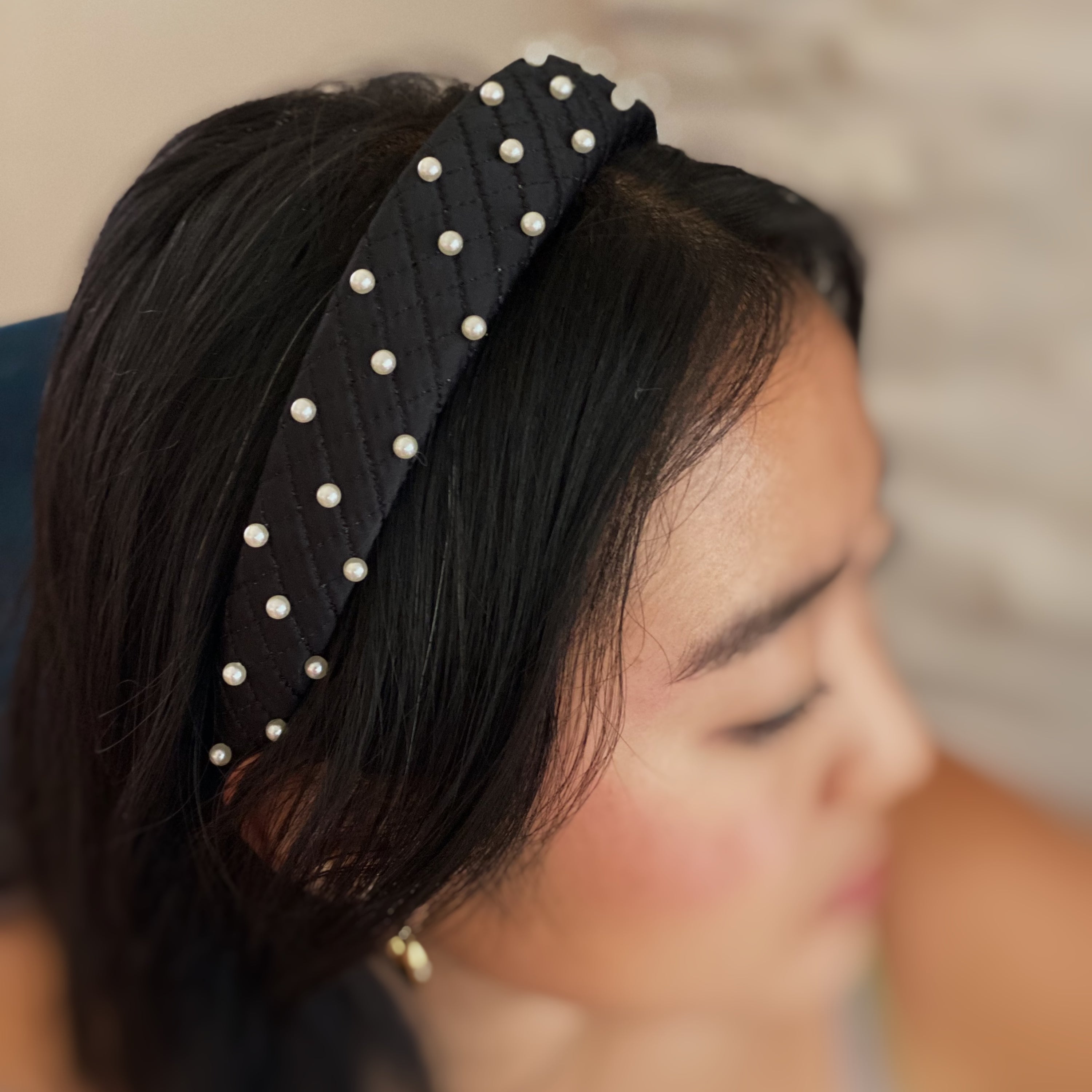 Quilted Elegance Pearl Headband featuring quilted fabric and hand-nailed small pearls, perfect for elegant styling.