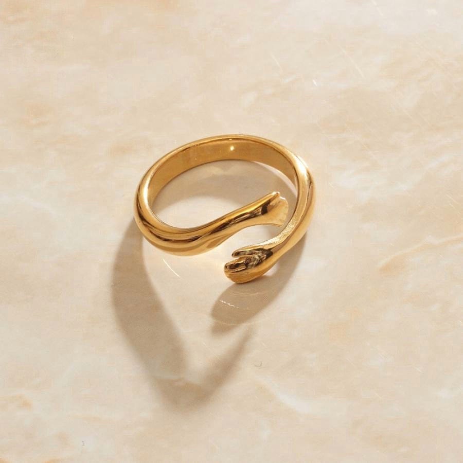 Quinn Love Hug Ring featuring a unique adjustable design in stainless steel with 18Kt yellow gold coating.