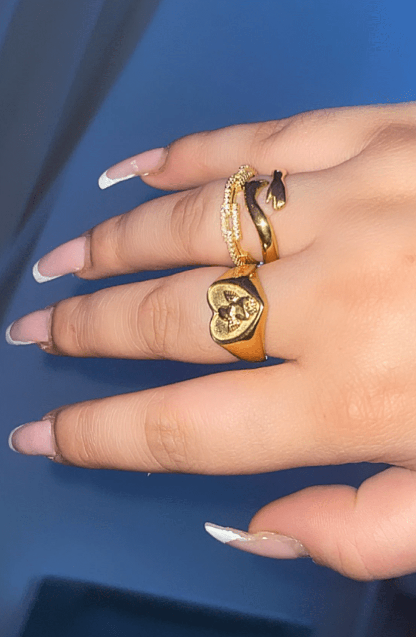 Quinn Love Hug Ring featuring a unique adjustable design in stainless steel with 18Kt yellow gold coating.