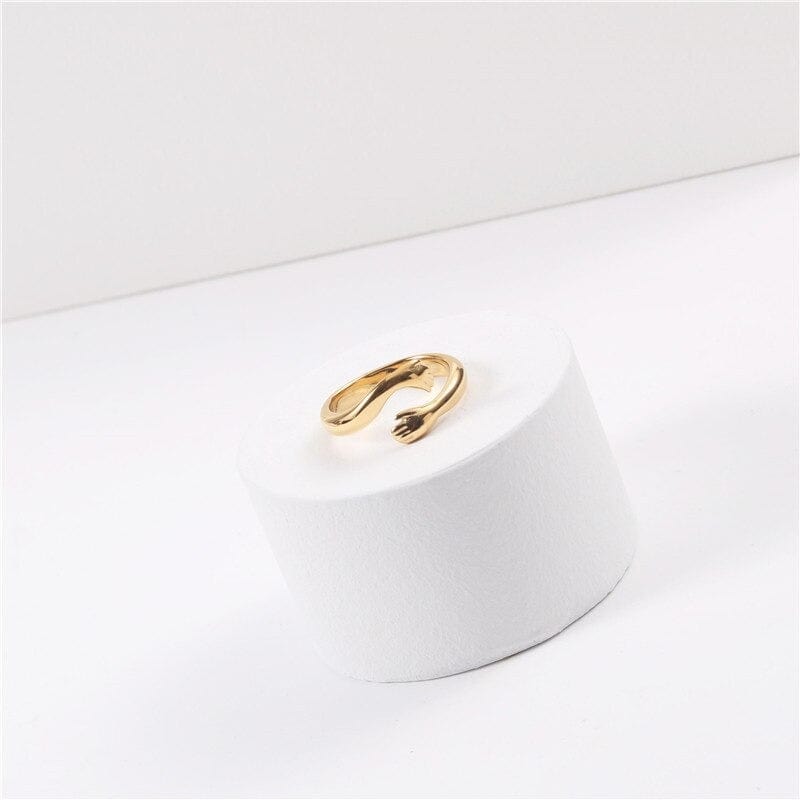 Quinn Love Hug Ring featuring a unique adjustable design in stainless steel with 18Kt yellow gold coating.