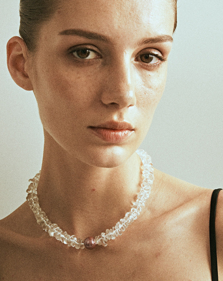 Radiant Majesty Transparent Crystal and Pearl Necklace featuring natural conch pearls and clear crystals, showcasing elegance and unique design.