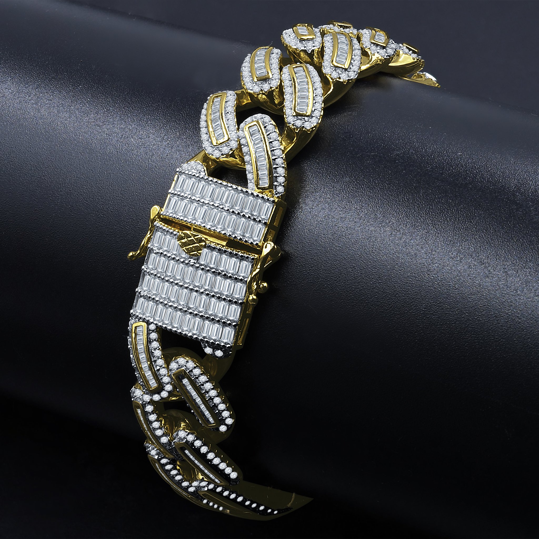 A radiant silver bracelet featuring sparkling cubic zirconia stones set in a golden tone, showcasing elegant craftsmanship.