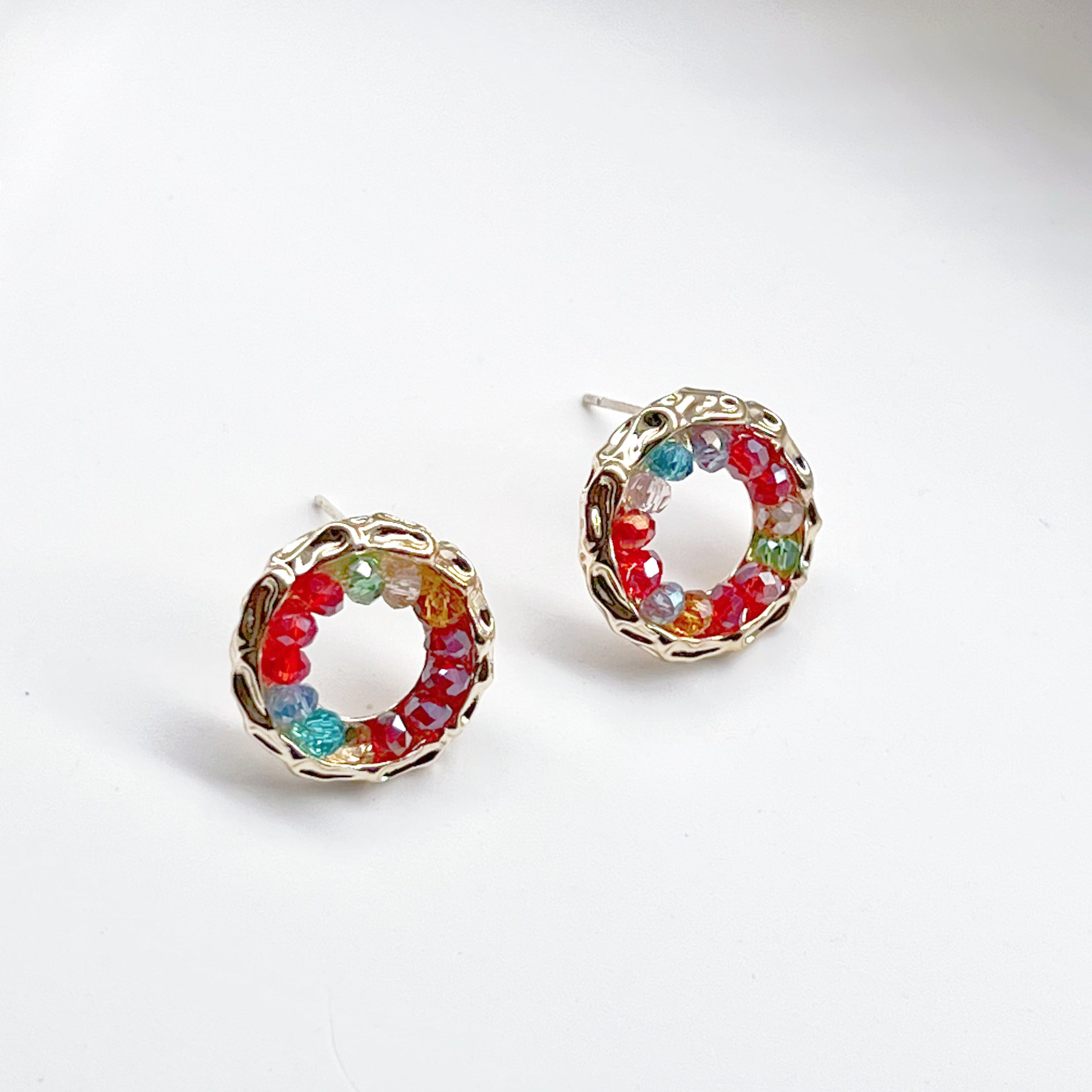 Colorful rainbow beads in a gold circle stud earring design, perfect for summer outfits.