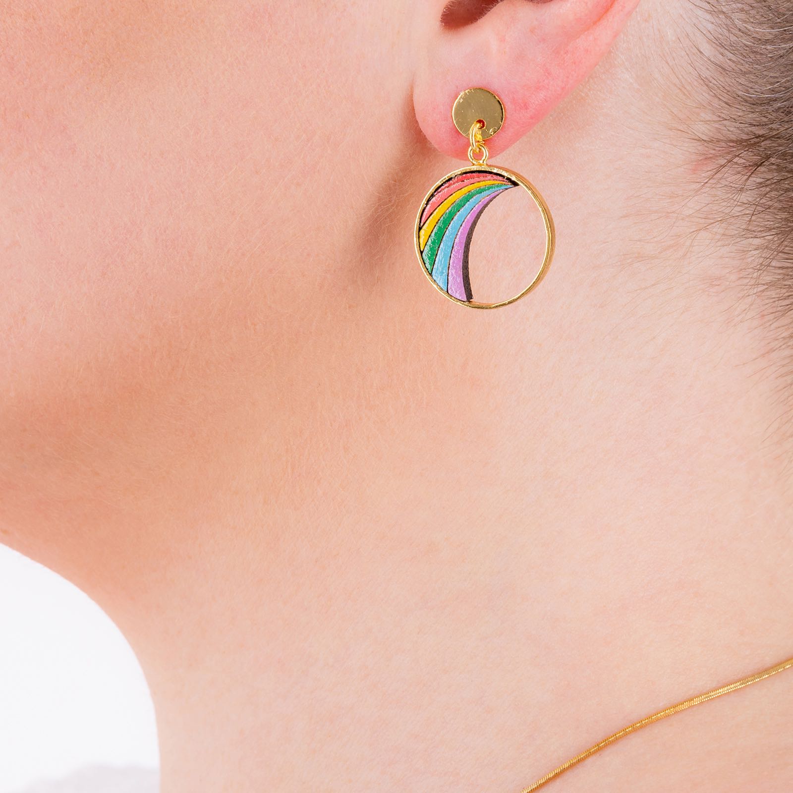 A pair of Rainbow Eco-friendly Recycled Wood Gold Earrings showcasing unique wood patterns and 24K gold plating, elegantly displayed in a luxury gift box.