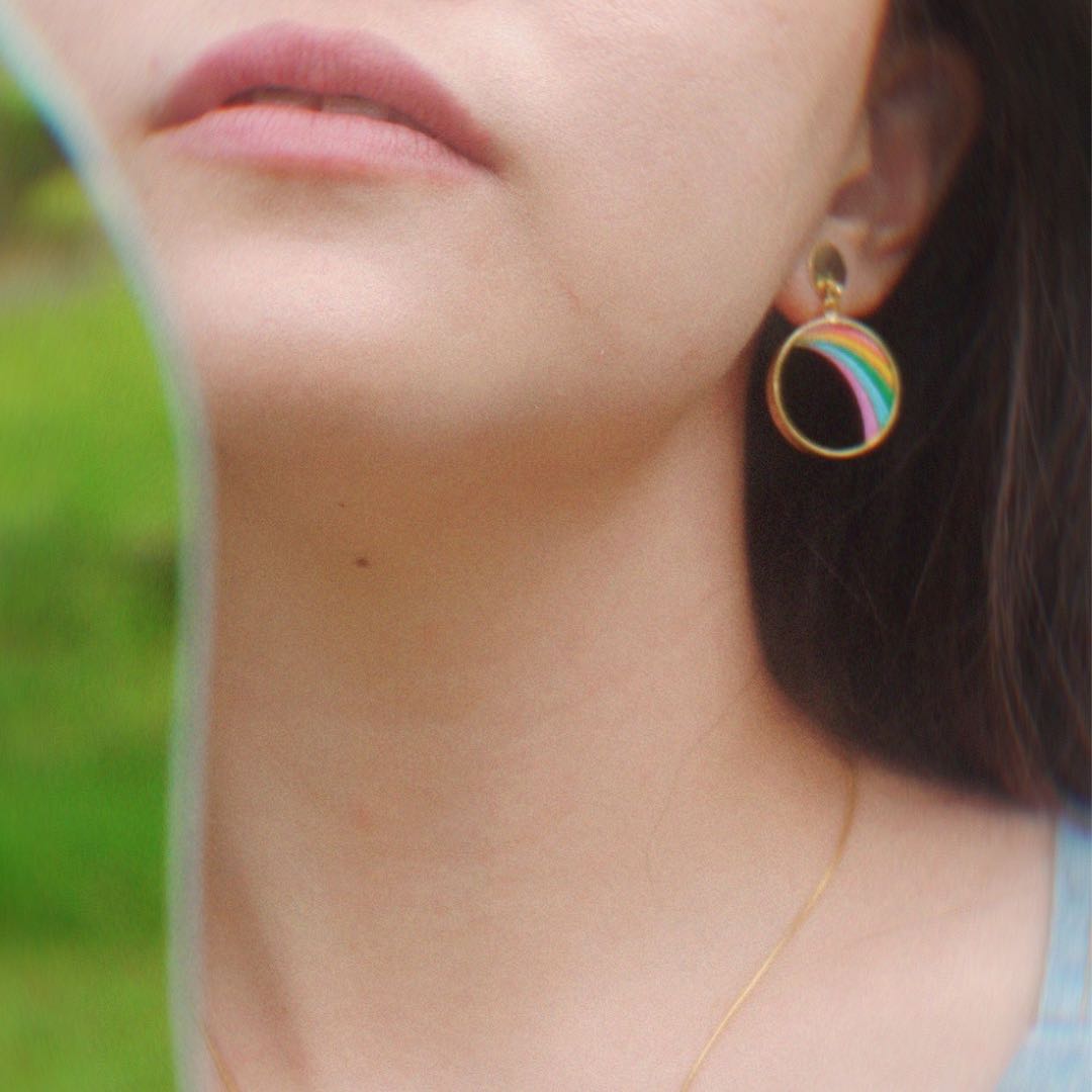 A pair of Rainbow Eco-friendly Recycled Wood Gold Earrings showcasing unique wood patterns and 24K gold plating, elegantly displayed in a luxury gift box.