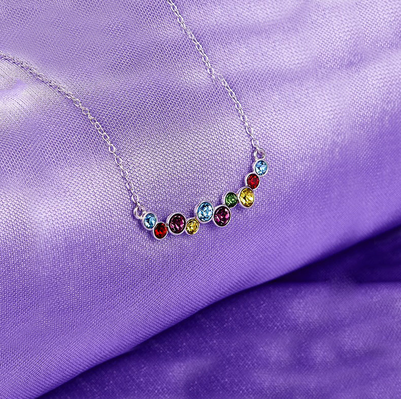 Rainbow of Love Necklace featuring rhodium plating and multi-color cubic zirconia stones on a link chain.