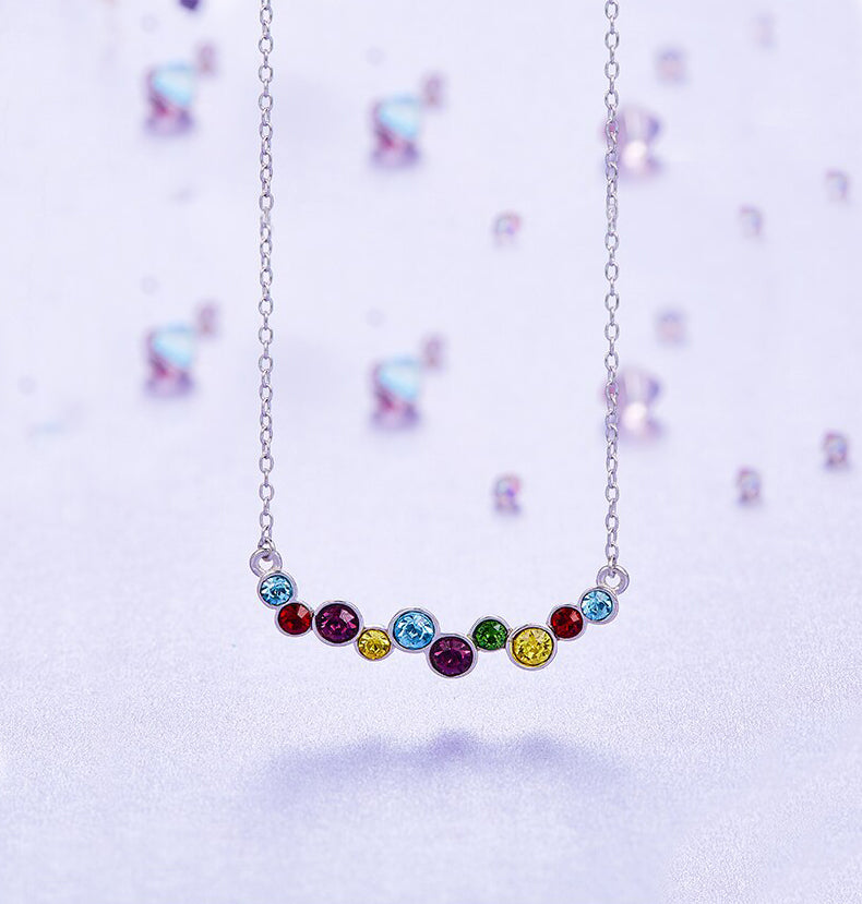 Rainbow of Love Necklace featuring rhodium plating and multi-color cubic zirconia stones on a link chain.