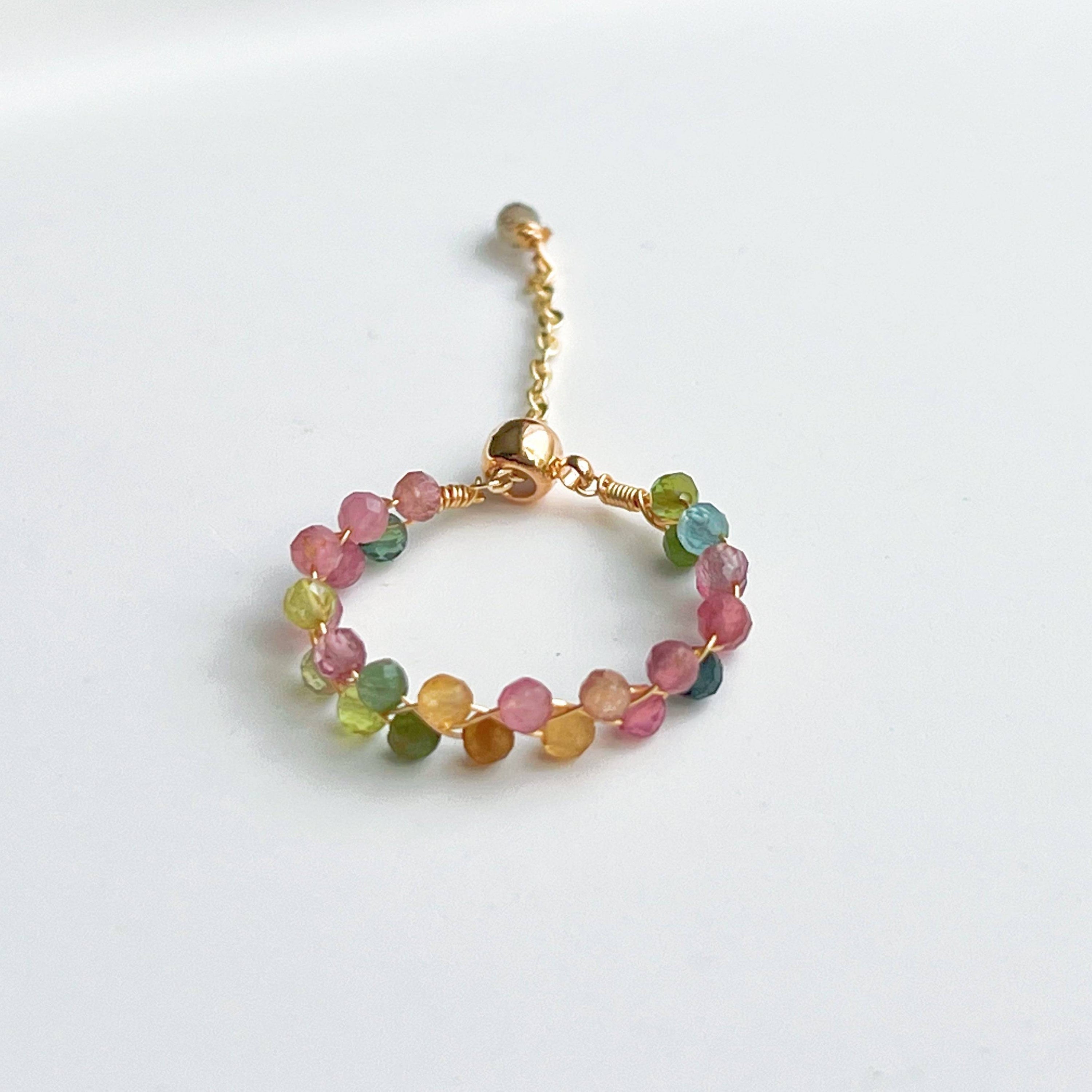 Rainbow Tourmaline Beaded Ring featuring adjustable gold plated bronze wire and vibrant natural gemstones.