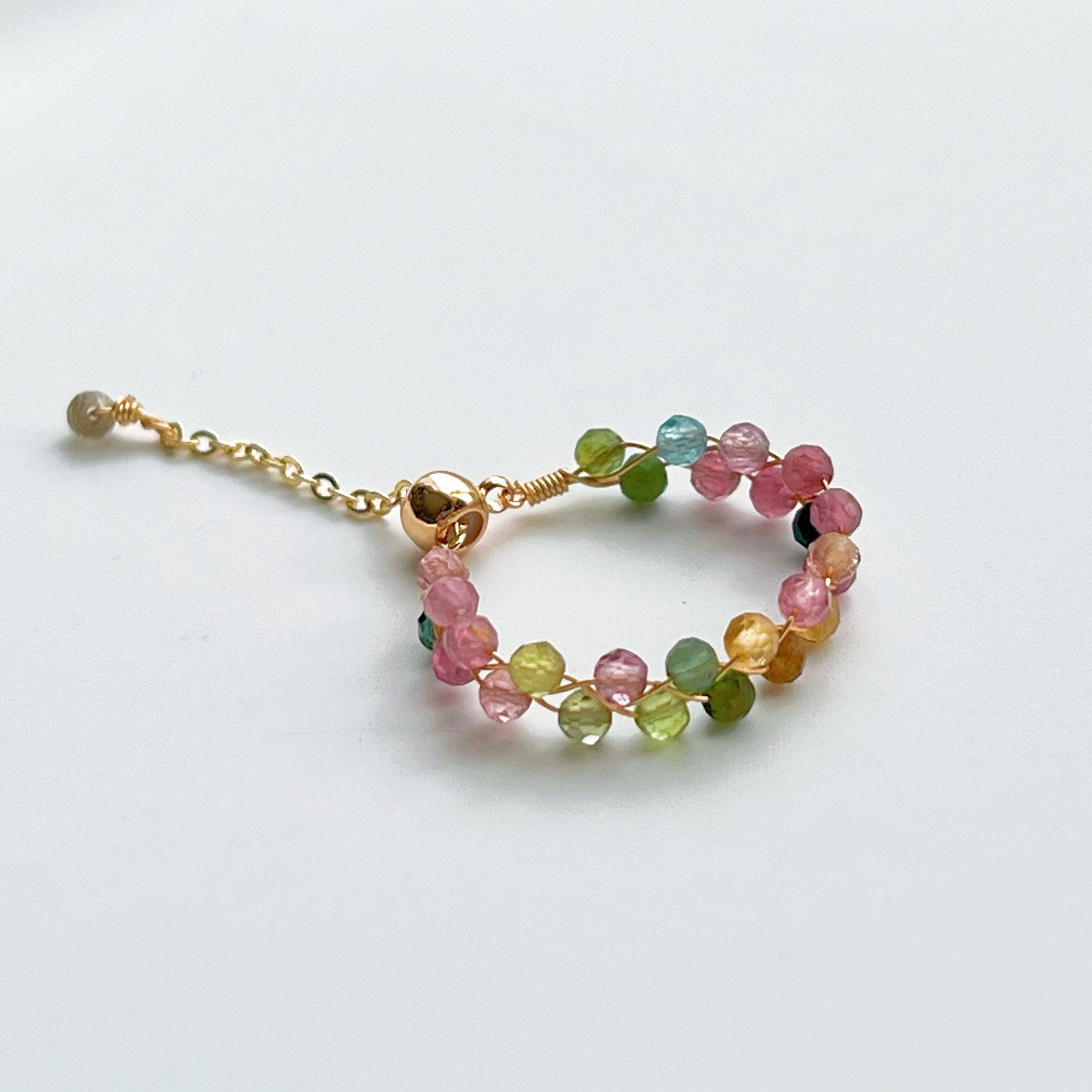 Rainbow Tourmaline Beaded Ring featuring adjustable gold plated bronze wire and vibrant natural gemstones.