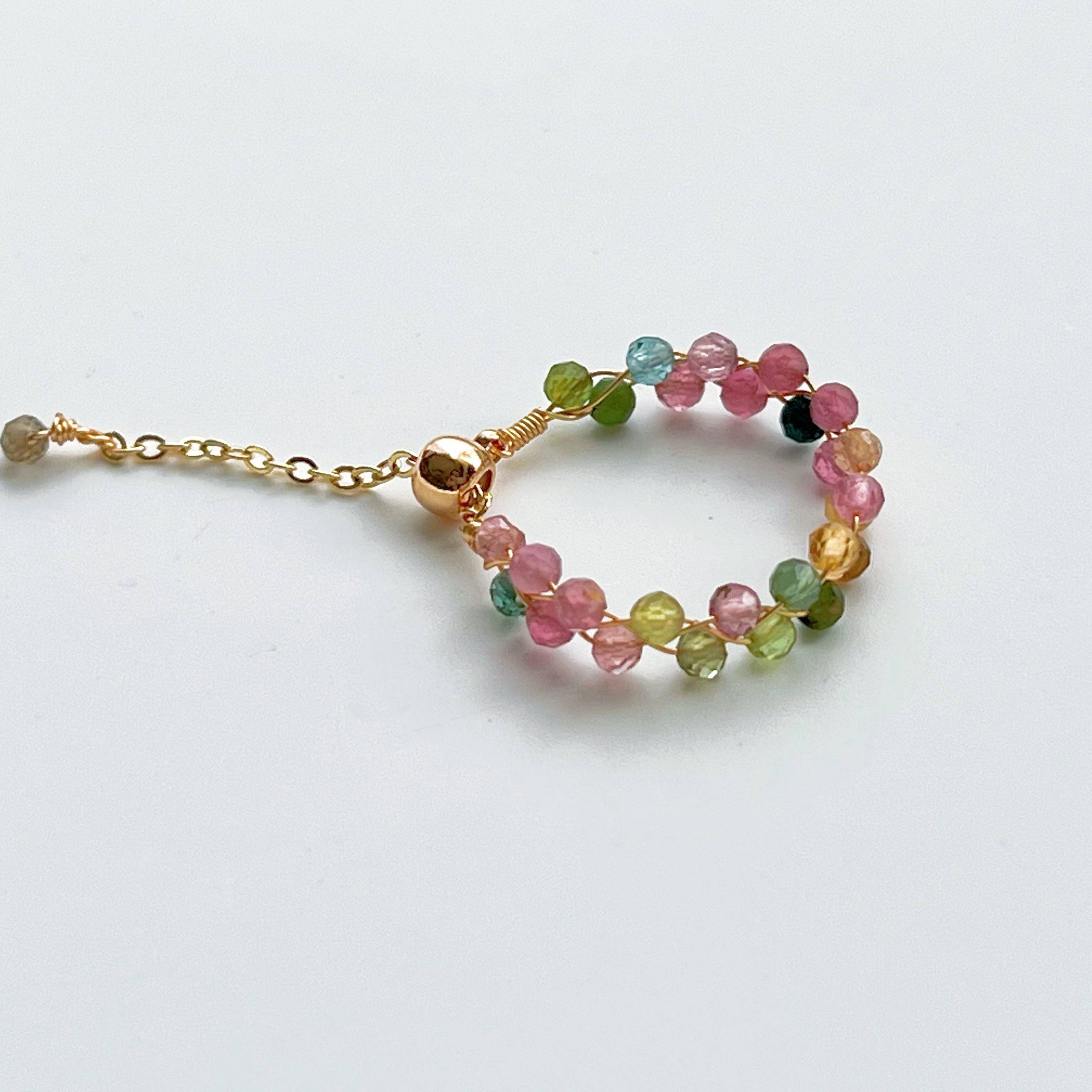 Rainbow Tourmaline Beaded Ring featuring adjustable gold plated bronze wire and vibrant natural gemstones.