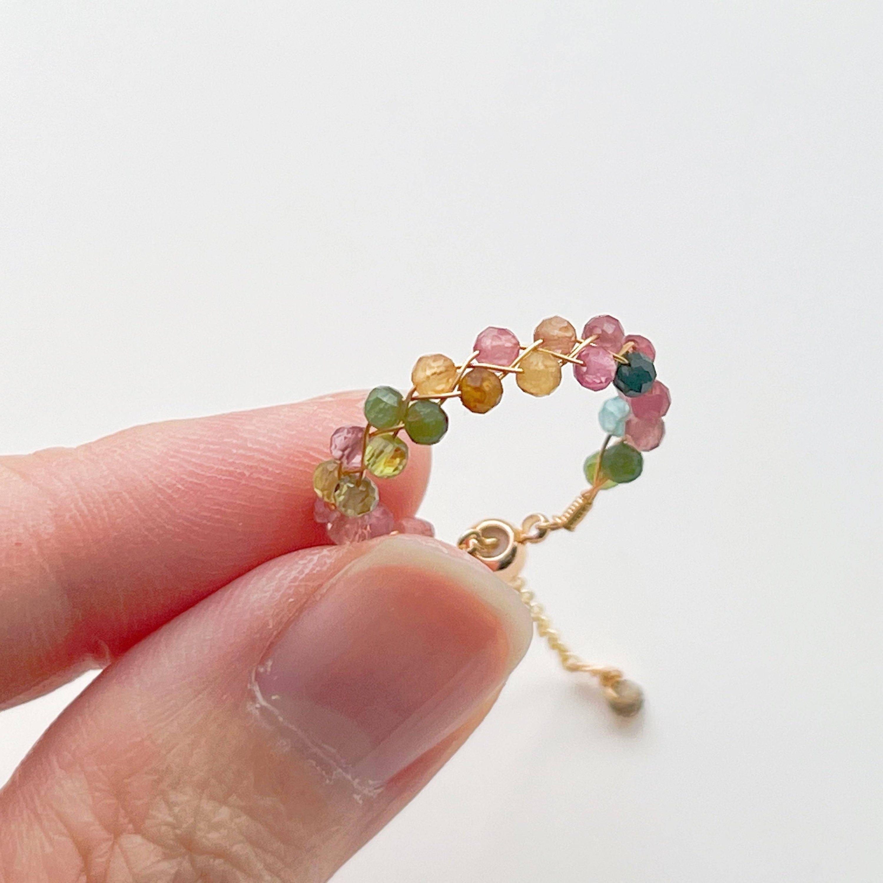 Rainbow Tourmaline Beaded Ring featuring adjustable gold plated bronze wire and vibrant natural gemstones.