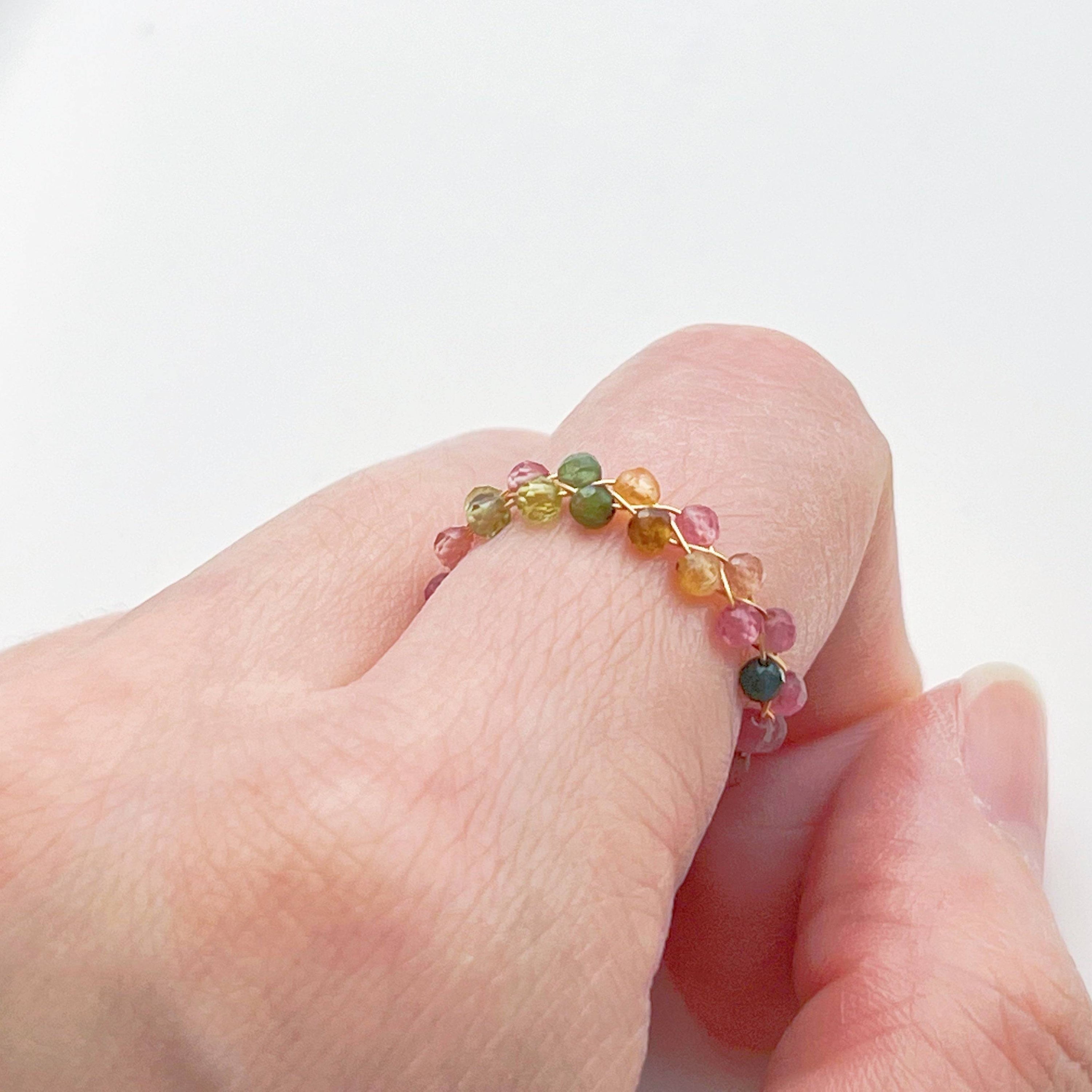 Rainbow Tourmaline Beaded Ring featuring adjustable gold plated bronze wire and vibrant natural gemstones.