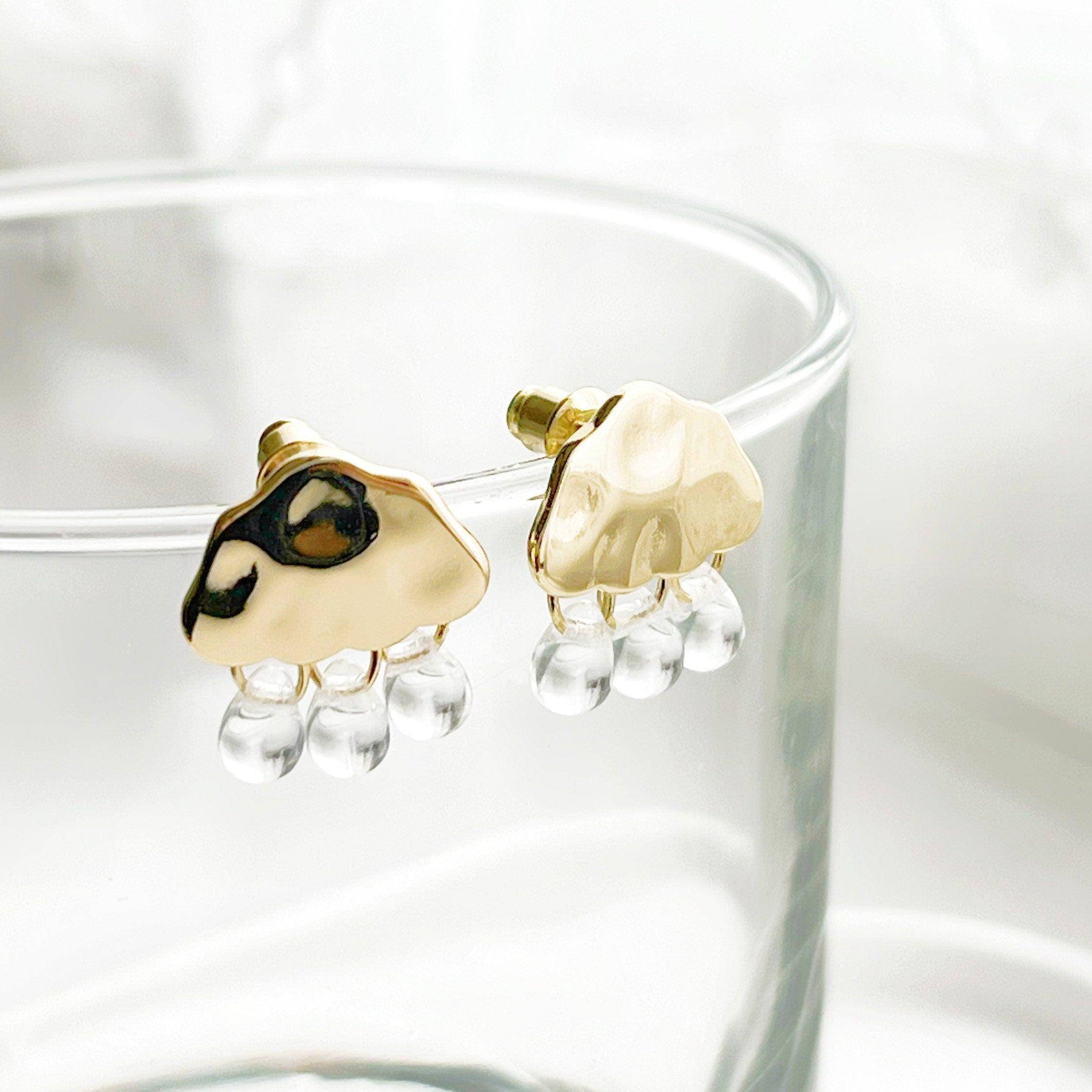 Raining Day Earrings featuring gold cloud design with crystal rain drops, elegantly displayed in a gift box.