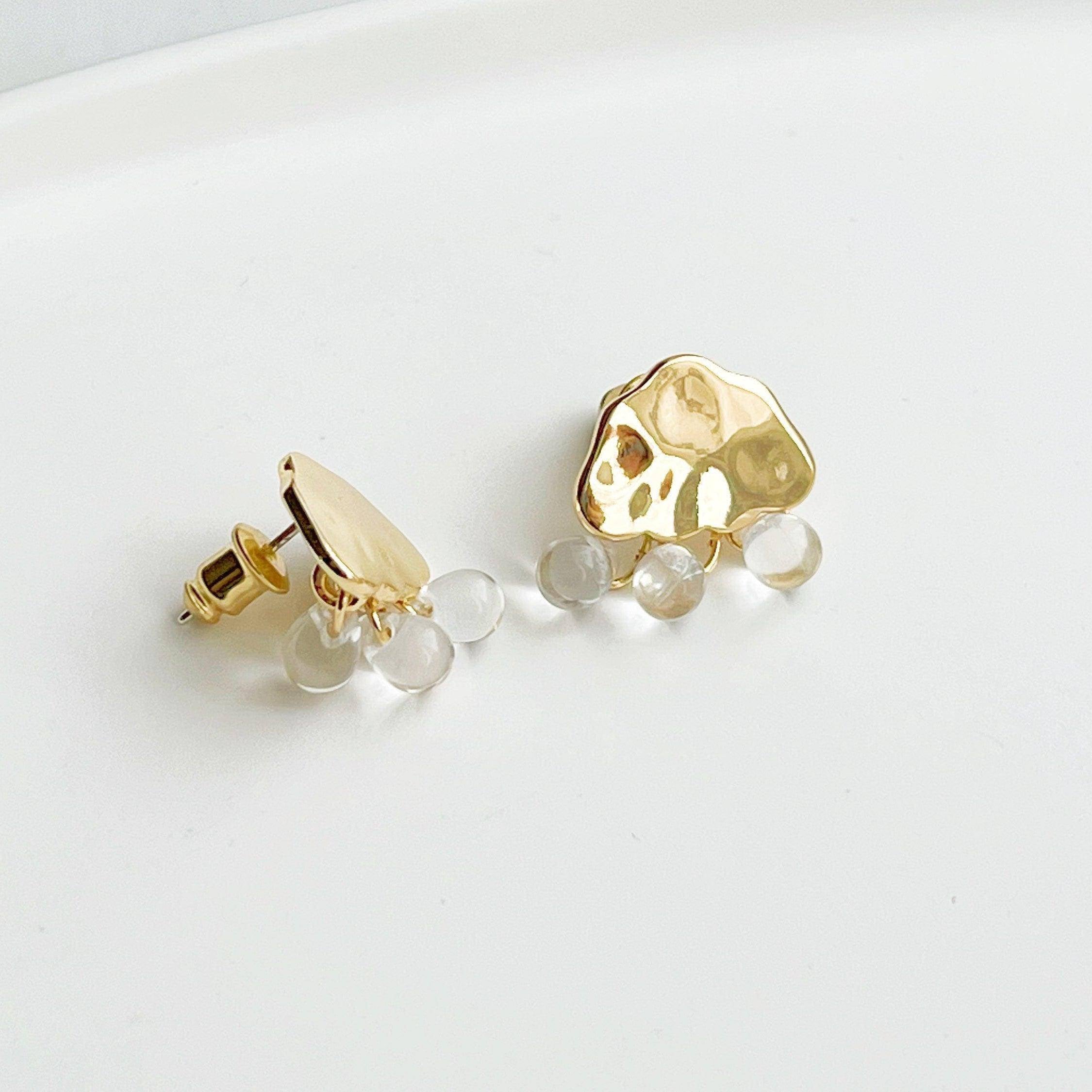 Raining Day Earrings featuring gold cloud design with crystal rain drops, elegantly displayed in a gift box.