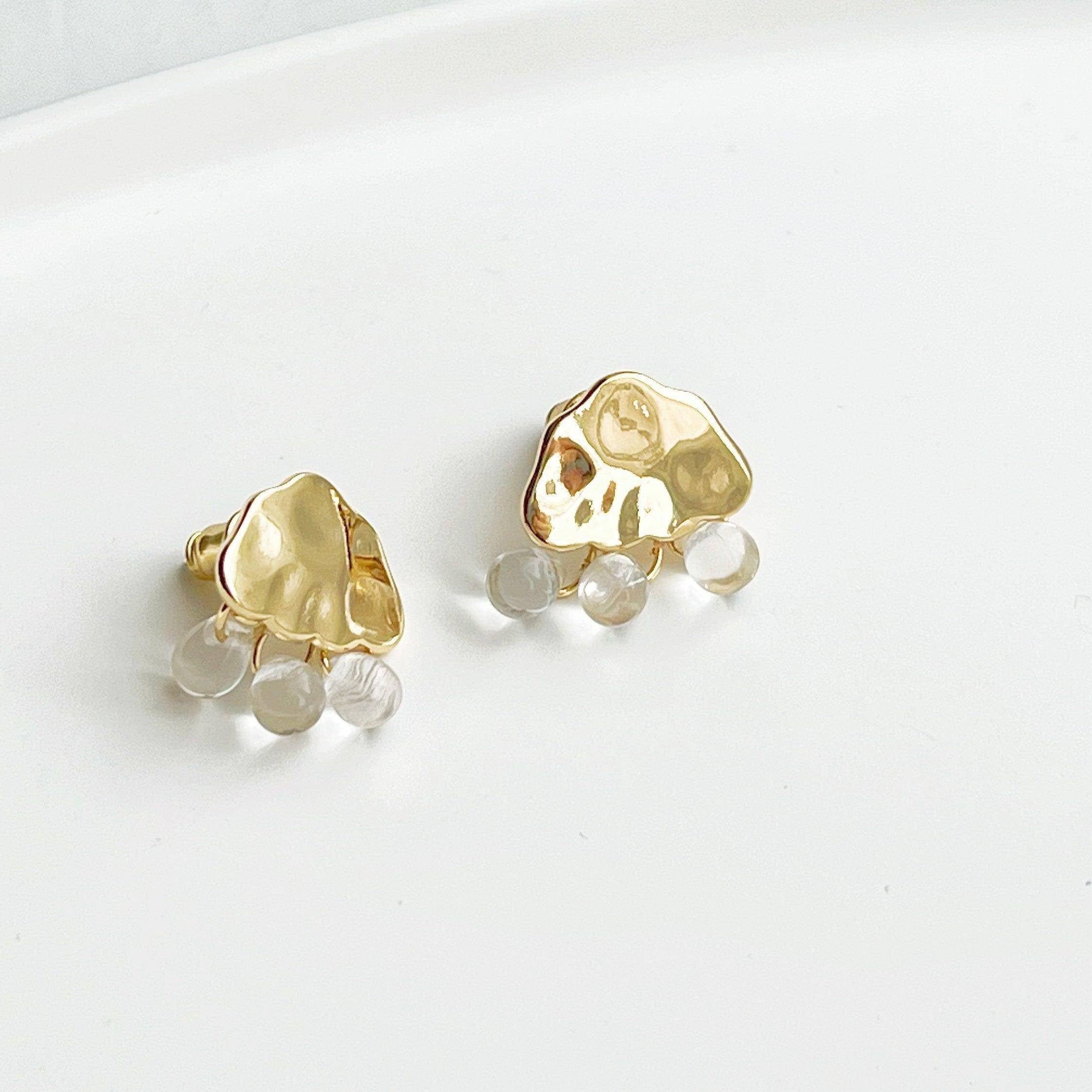 Raining Day Earrings featuring gold cloud design with crystal rain drops, elegantly displayed in a gift box.