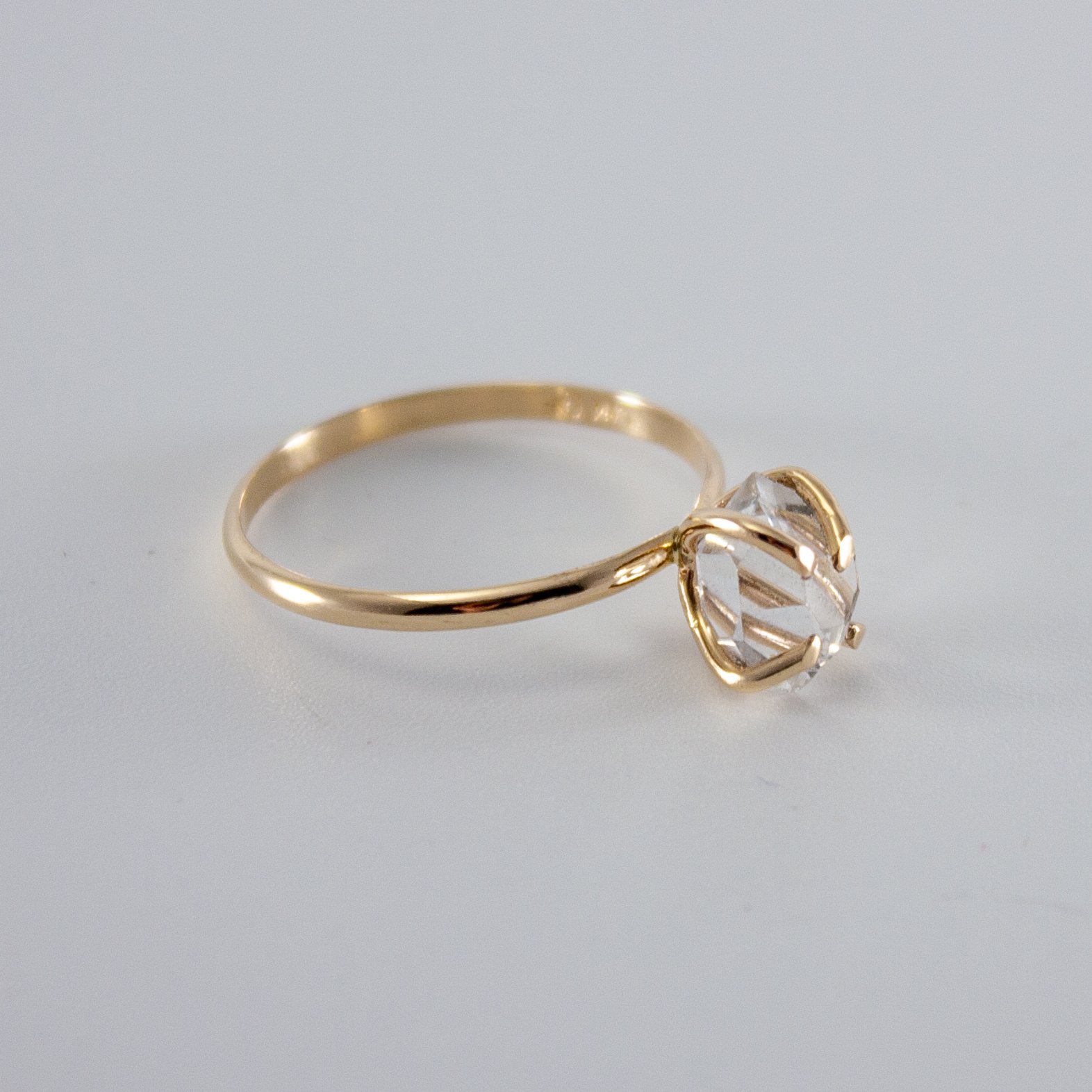 A stunning Raw Herkimer Diamond set in a 14k gold filled prong ring, showcasing its natural brilliance and unique shape.