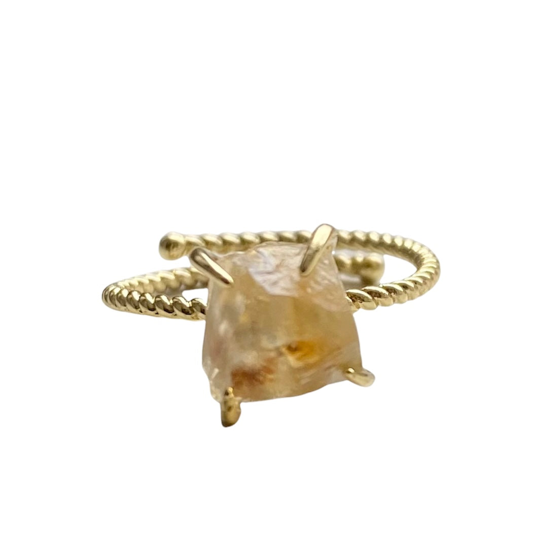 A stunning gold plated raw nugget claw ring featuring various crystals, showcasing its unique design and adjustable fit.