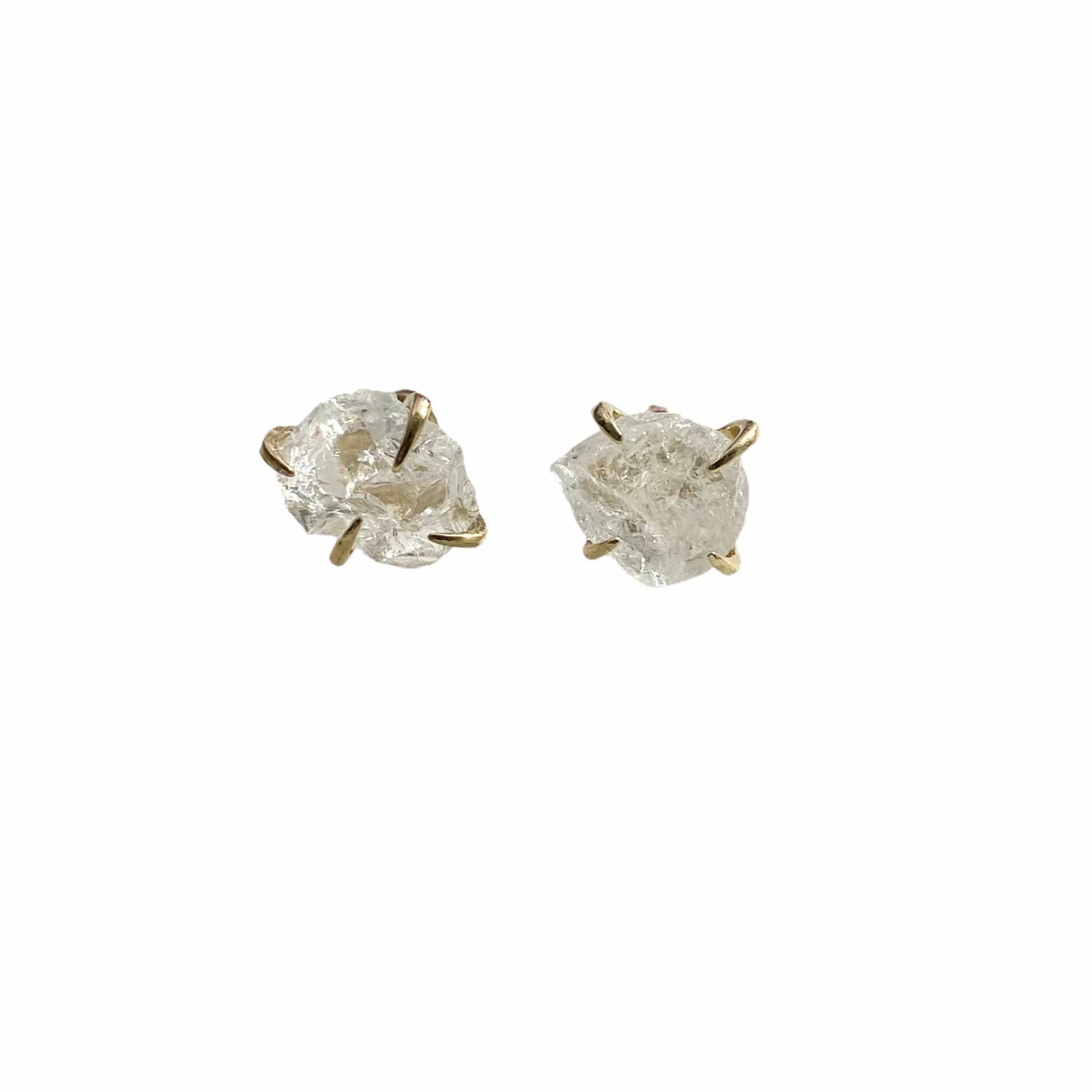 A pair of gold plated raw crystal nugget claw studs showcasing unique crystal designs.