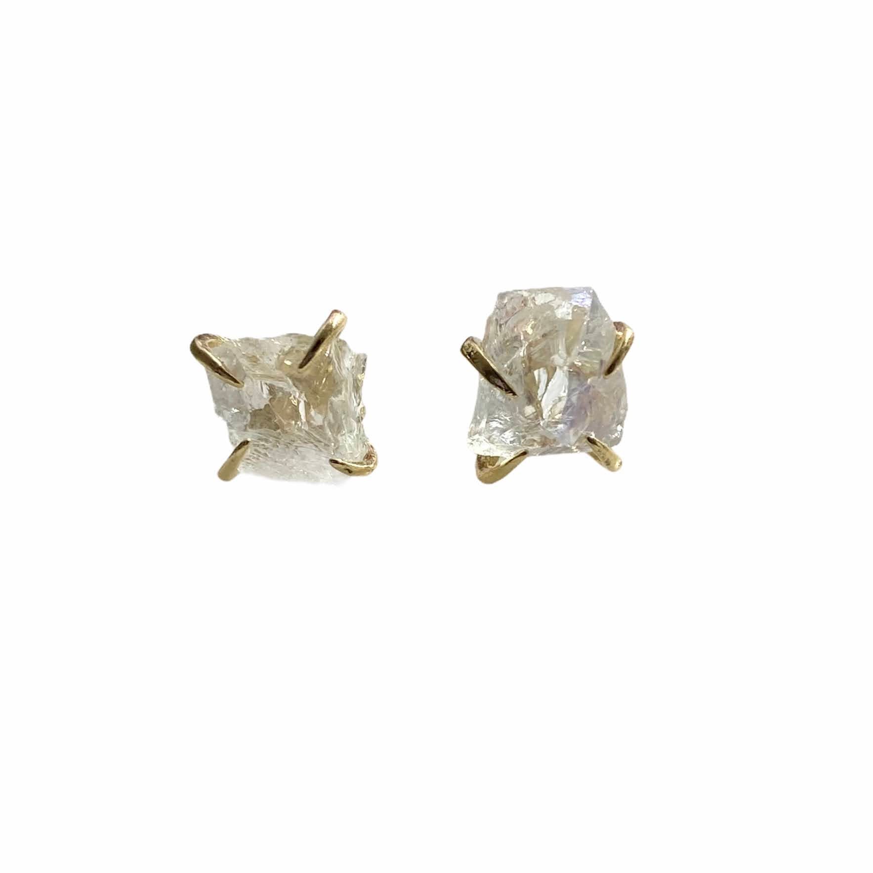 A pair of gold plated raw crystal nugget claw studs showcasing unique crystal designs.