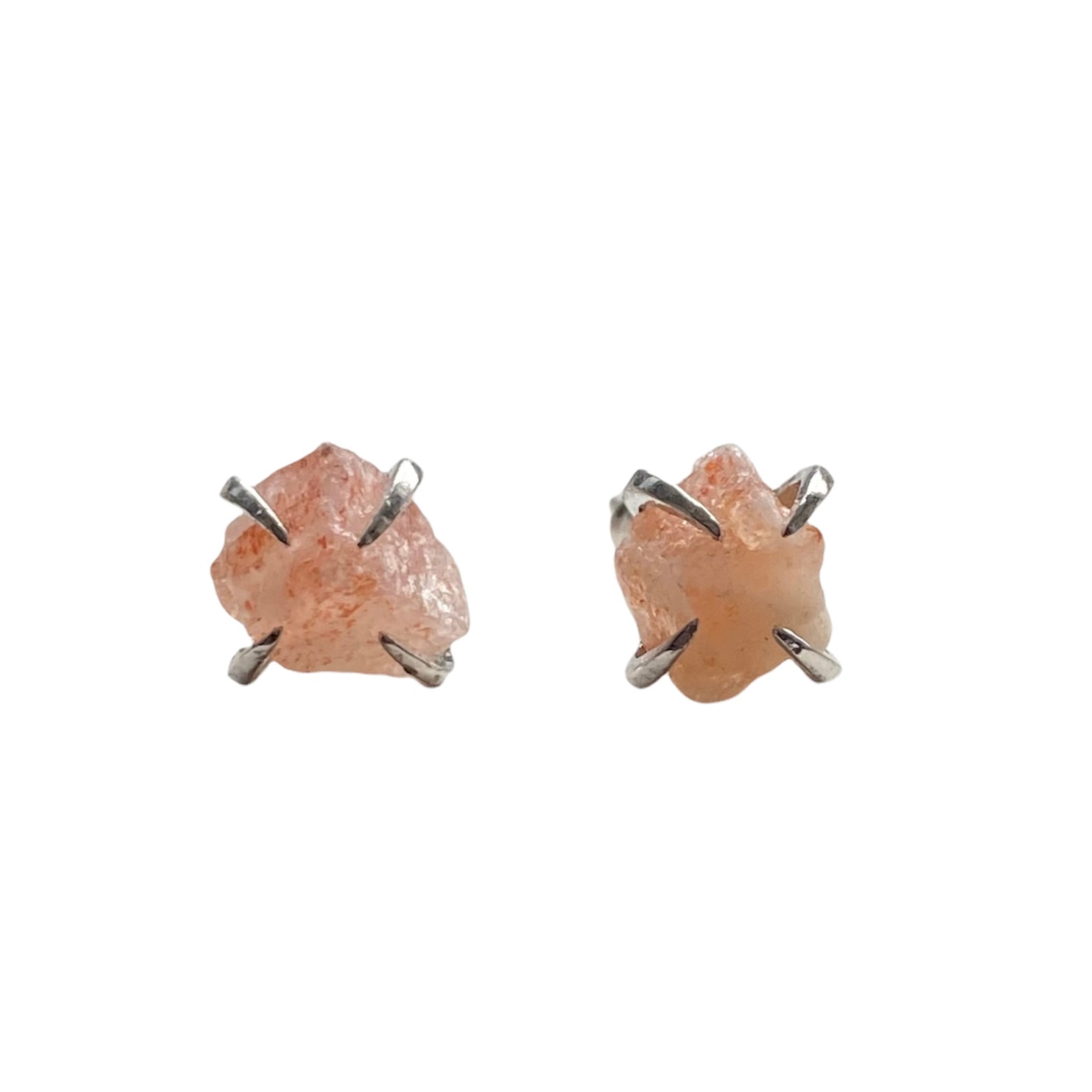 A pair of silver plated raw crystal nugget claw studs featuring various crystals like amethyst and rose quartz, showcasing their unique design.