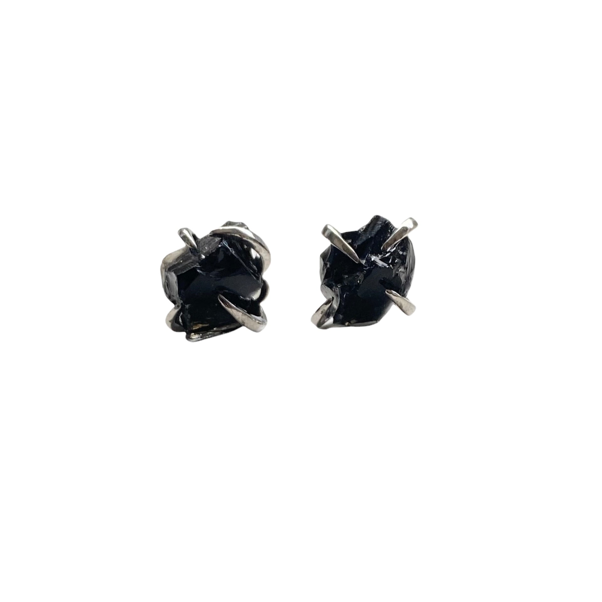 A pair of silver plated raw crystal nugget claw studs featuring various crystals like amethyst and rose quartz, showcasing their unique design.