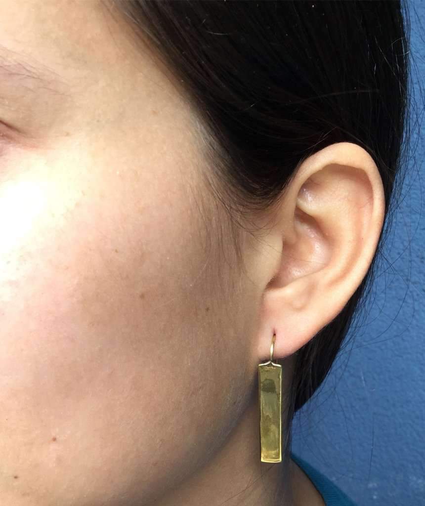 Stylish rectangular drop earrings made of brass and silver, featuring a unique design perfect for festivals and everyday wear.