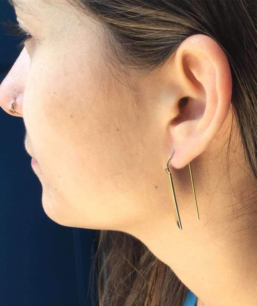 Stylish rectangular drop earrings made of brass and silver, featuring a unique design perfect for festivals and everyday wear.