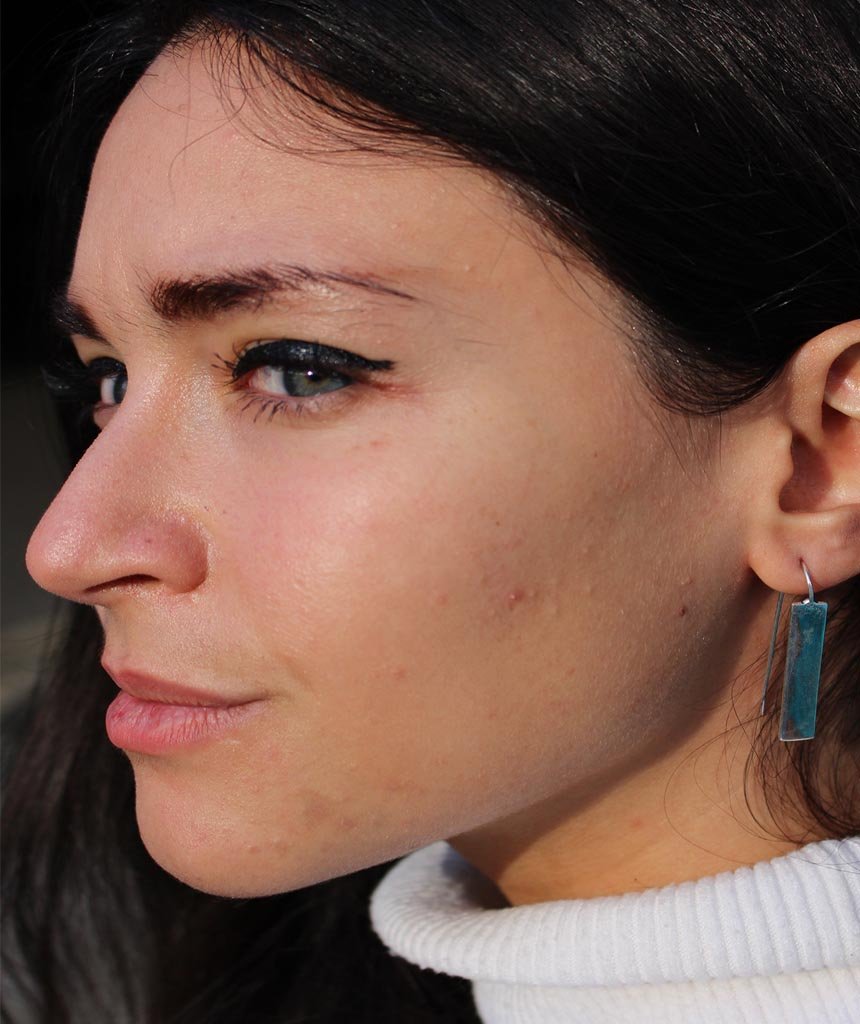 Stylish rectangular drop earrings made of brass and silver, featuring a unique design perfect for festivals and everyday wear.