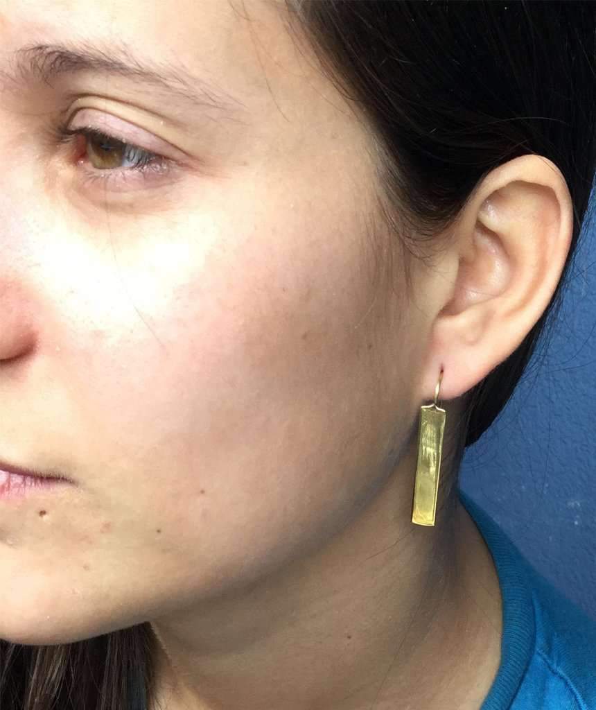 Stylish rectangular drop earrings made of brass and silver, featuring a unique design perfect for festivals and everyday wear.