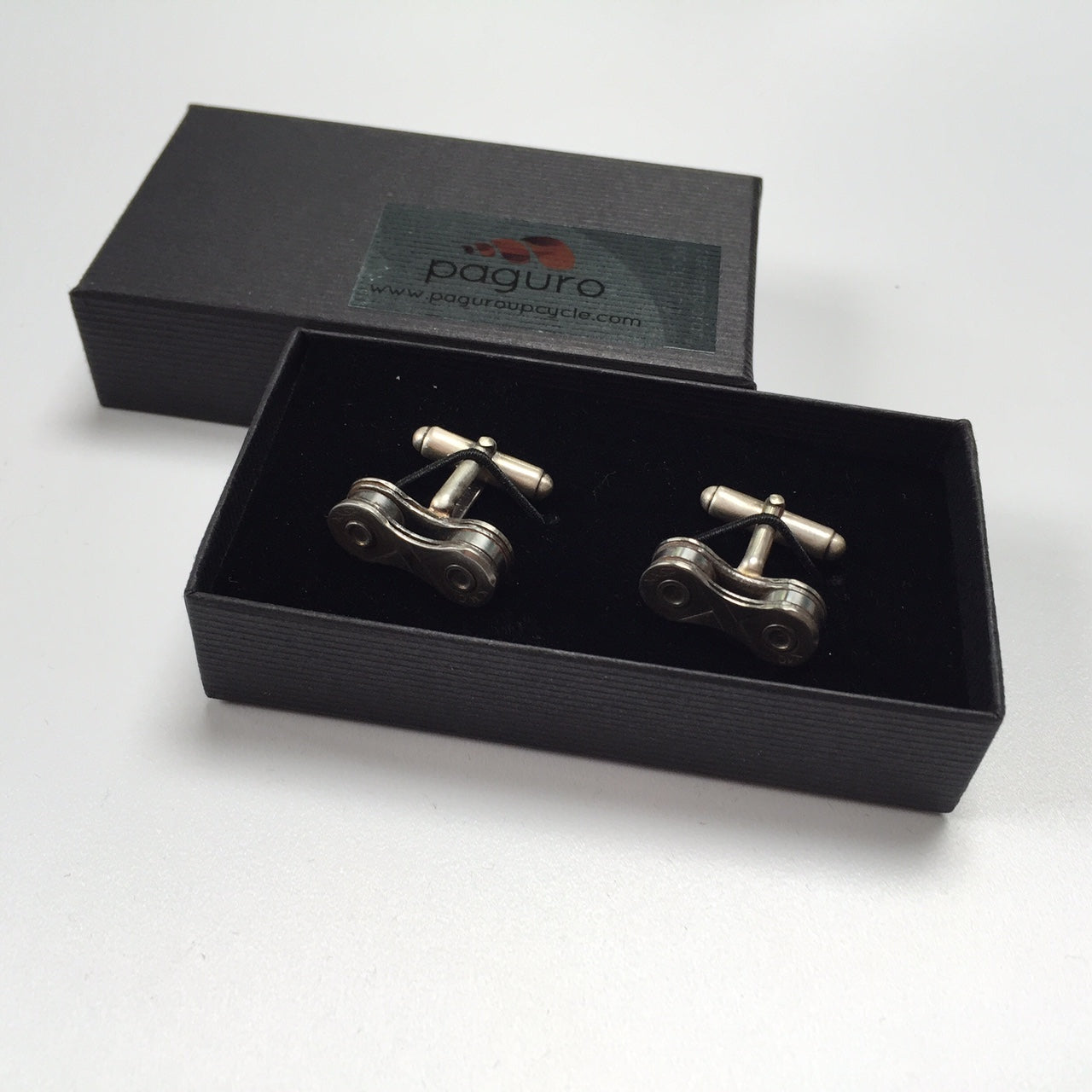 Handcrafted Recycled Bicycle Chain Cufflinks in three colors, featuring silver plated links.