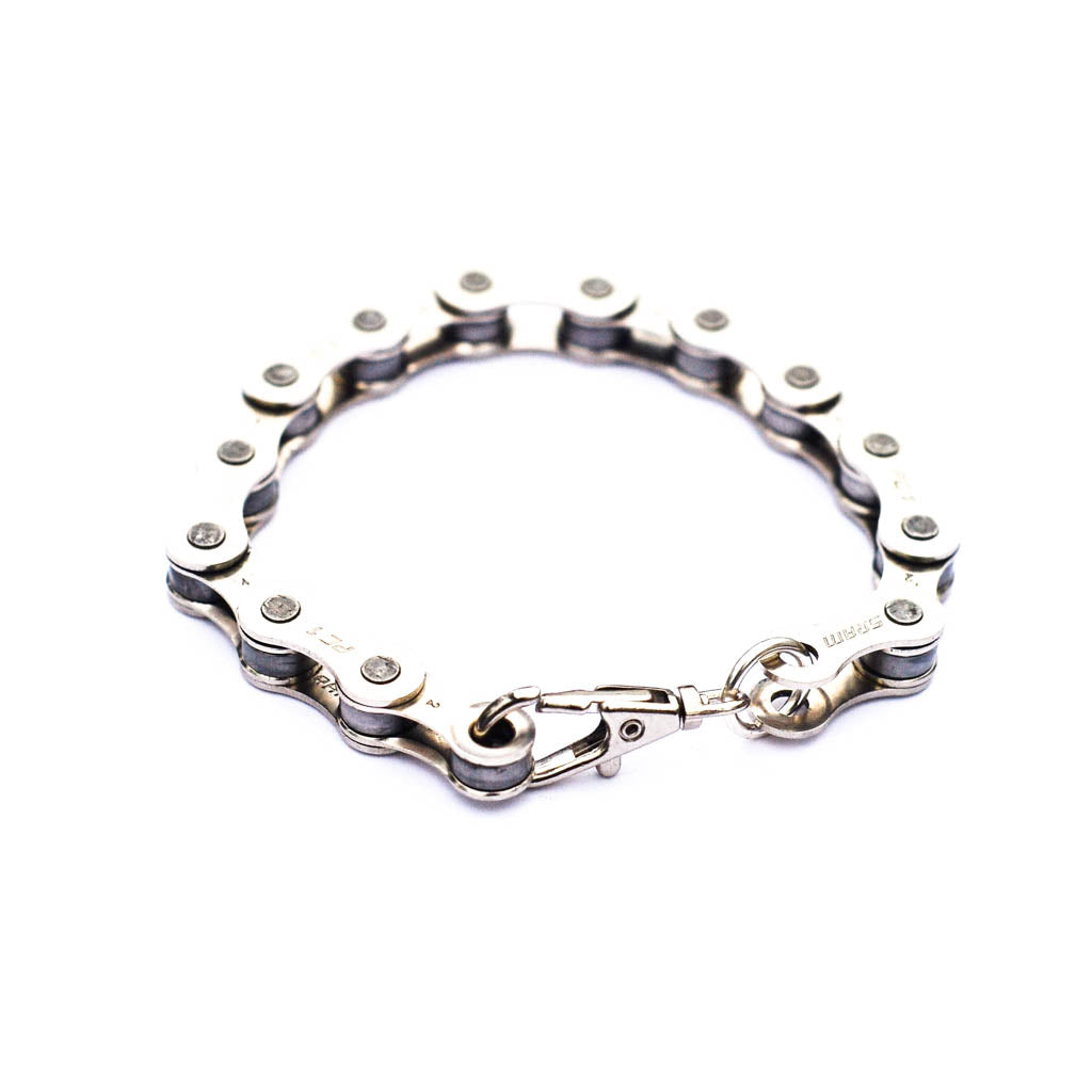 A stylish Recycled Bike Chain Bracelet made from upcycled bike chains, showcasing its unique design and eco-friendly materials.