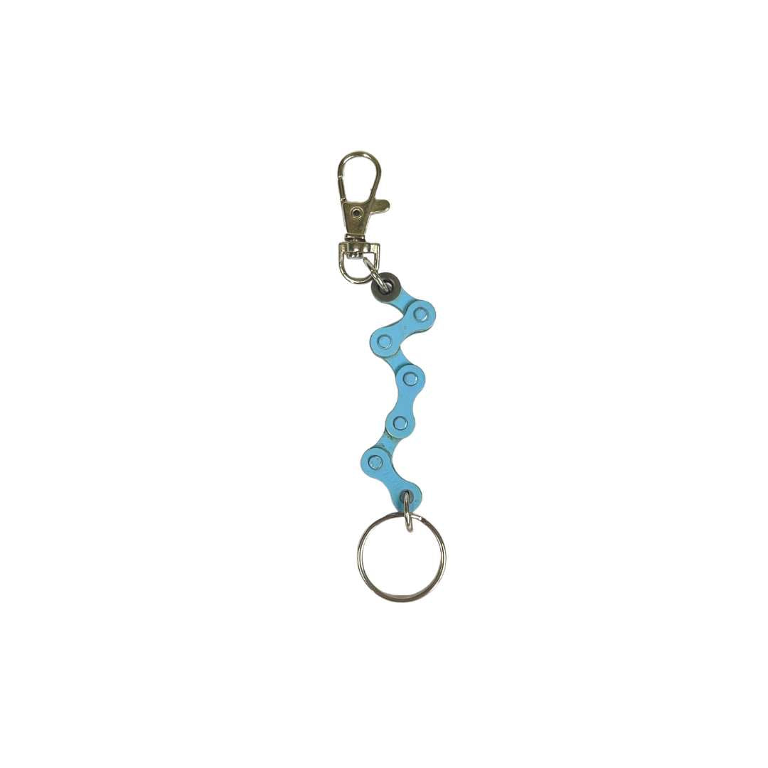 A handmade vegan keyring made from recycled bike chains, featuring a clasp and keyring for versatile use.