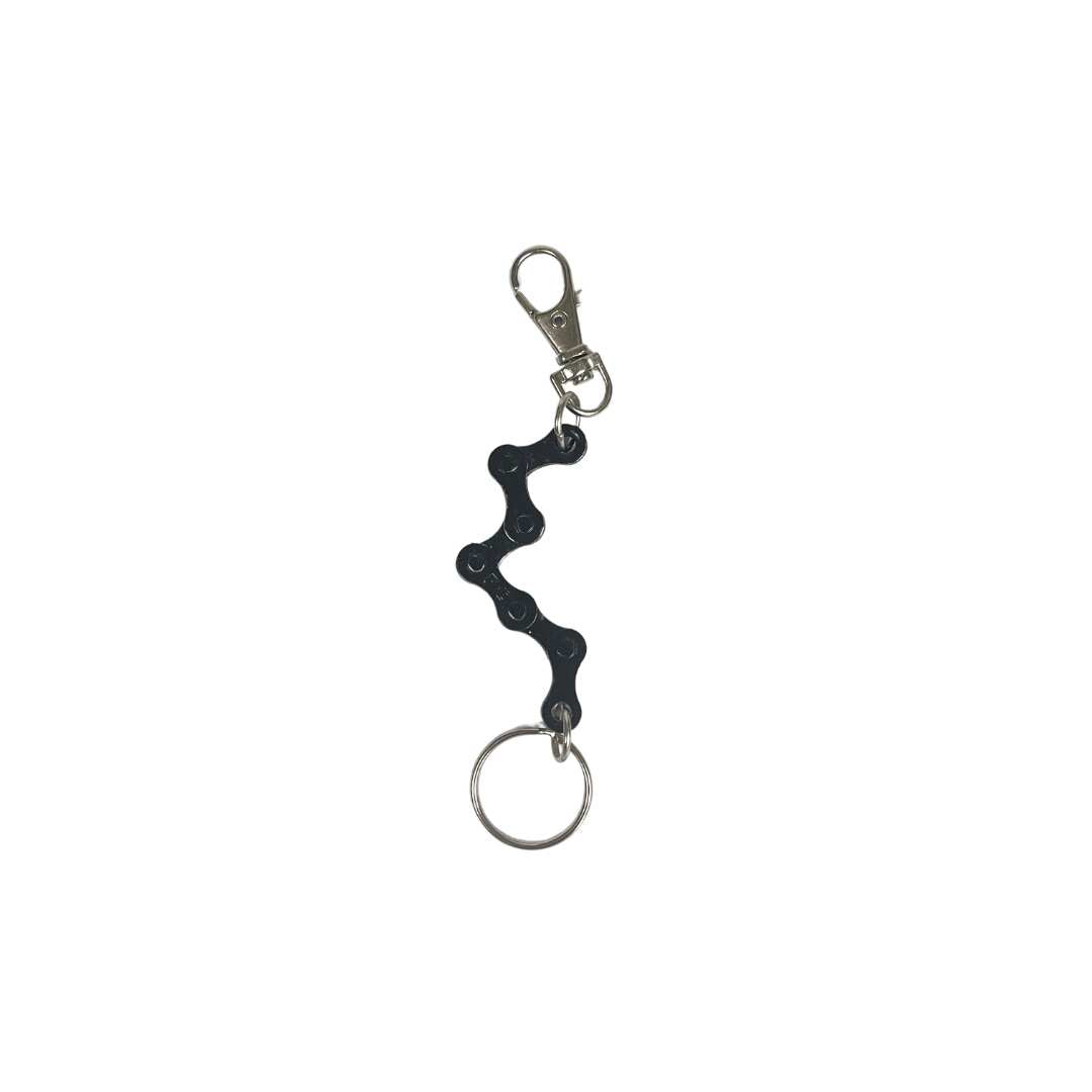 A handmade vegan keyring made from recycled bike chains, featuring a clasp and keyring for versatile use.