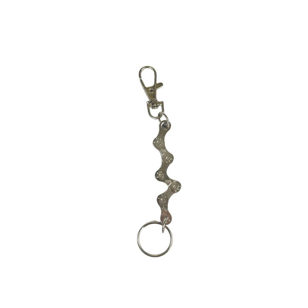 A handmade vegan keyring made from recycled bike chains, featuring a clasp and keyring for versatile use.