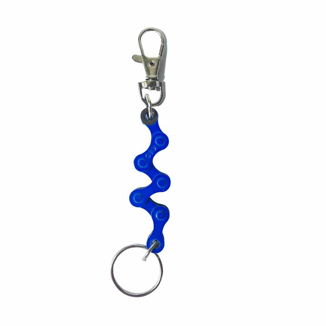 A handmade vegan keyring made from recycled bike chains, featuring a clasp and keyring for versatile use.