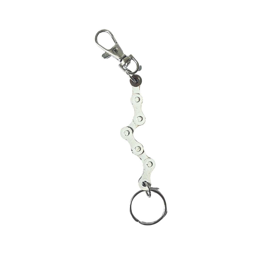 A handmade vegan keyring made from recycled bike chains, featuring a clasp and keyring for versatile use.